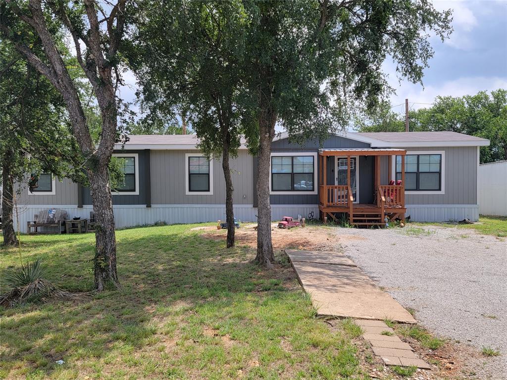 Welcome to Lake Brownwood. This like new 4 bedroom 2 bath waterfront home is ideal for family living or a recreational weekend getaway lake home. Has a good size boat dock with slip and when the lake is full the water depth should be around 16-18 foot deep. Lovely rock formation with a path leading to the waters edge.  Inside the home is a kitchen living room open concept with a fantastic island.  The flooring is vinyl plank throughout with carpet in the bedrooms. Has a nice and spacey master bathroom with a stand-up shower, a soaker tub and double vanities. The Large covered back deck overlooking the water is perfect for outdoor entertaining. Parking is out front and has 3 covered parking areas.