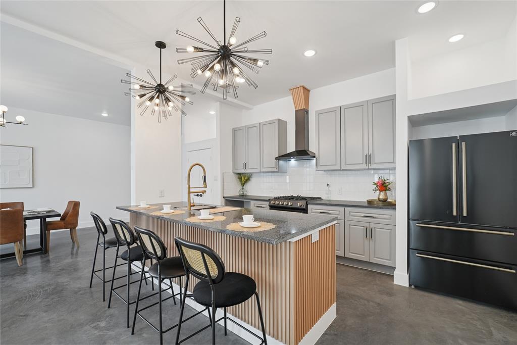 Modern new construction duplex in the heart of East Dallas, featuring two identical units with 3 bedrooms and 2.5 baths each. The striking exterior combines white siding with black metal accents for sleek, contemporary curb appeal.

Inside, double height ceilings and a statement staircase create an impressive entry. The open-concept first floor offers a spacious dining area and a beautifully designed kitchen with stunning black appliances, perfect for everyday living and entertaining.

Upstairs, a flexible loft with built-in cabinetry provides space for a bar, office, or lounge. The spacious primary suite includes a spa-like bath with double vanities, walk-in shower, and walk-in closet, with direct access to the laundry room for added convenience. Two additional bedrooms complete the second level.

Each unit features a private backyard and balcony for seamless indoor-outdoor living. Ideally located just minutes from Downtown Dallas with easy access to major highways, restaurants, shopping, and entertainment, offering the perfect blend of modern design and urban convenience.