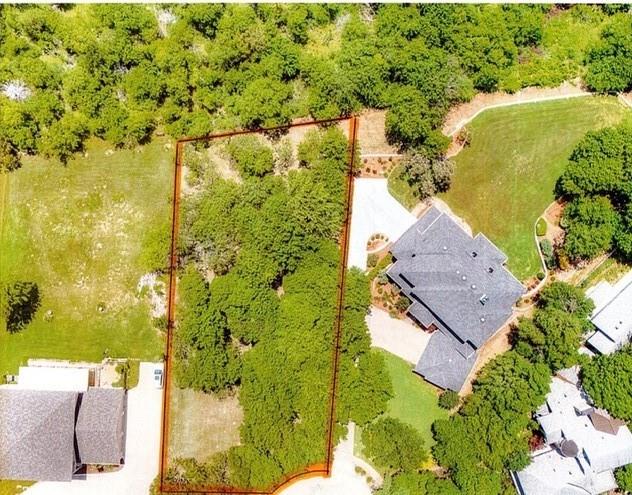 Rare opportunity to own a beautiful .50-acre lakefront lot tucked away on a quiet cul-de-sac with stunning water views and direct access to lakeside living. This premium homesite offers the perfect setting to build your custom dream home with peaceful surroundings, mature natural scenery, and exceptional privacy. Enjoy breathtaking sunrise and sunset views over the water. Adjacent property with existing home is also available separately in the MLS under #21262662, offering a unique opportunity for expanded ownership, multi-generational living, or additional investment potential. Buyer to verify building requirements, utilities, and restrictions.