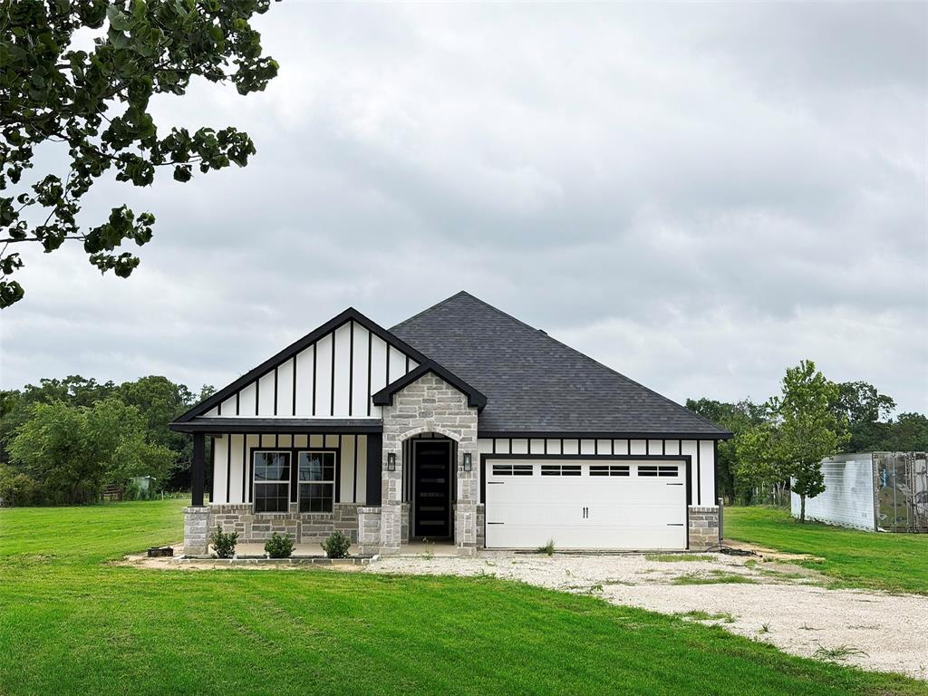 This beautiful new construction home was built with pride and attention to detail for the buyer who wants all the creature comforts without the hustle and bustle that comes with city living. The open, public areas make this a dream home for entertaining with dazzling white quartz counters, plenty of cabinets, and an island large enough to bring your tailgate party inside. When you are ready to rest, the split floorplan has the primary bedroom at the rear, two on the left when you enter and one on the right of the home. You will also love the walk-in showers and spacious bathrooms with tons of storage. Nestled at the end of a County Road cul-de-sac, you will never worry about passing traffic noise. Two+ acres provide lots of room for play or storage and there is a seasonal pond at the rear of the property. Storage trailers are negotiable. Seller is Agent friendly.