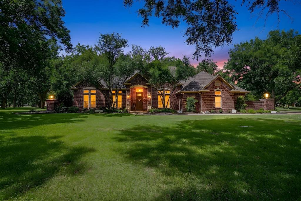 Experience resort-style living on a beautifully treed almost 2-acre lot in the sought-after, gated and guarded community of Pecan Plantation. This thoughtfully designed 2,724 sq ft home offers 3 bedrooms, 2 bathrooms, 2 living areas, 2 dining spaces, and a dedicated office, providing plenty of space for everyday living, working from home, and entertaining.

Inside, you’ll find decorative molding, a dining room accent wall, stained wood trim in the office, abundant built-in storage, and hard surface flooring throughout all but one bedroom for easy maintenance. The inviting living room features a striking rock fireplace flanked by built-ins and floating shelves. The spacious primary suite includes a large walk-in closet with all-season hanging, a full-length dressing mirror, and direct access to the oversized laundry room complete with a sink, extensive cabinetry, and space for an additional refrigerator. A generously sized secondary bedroom offers direct access to the screened patio, making it an ideal guest suite or flexible living space.

Step outside to the screened-in patio overlooking the beautifully landscaped, gated backyard, the perfect place to enjoy your morning coffee or unwind after a long day.

Pecan Plantation offers an unmatched lifestyle with access to Lake Granbury and the Brazos River, two championship golf courses, two private airstrips, two swimming pools, a marina, horse stables, walking trails, pickleball, tennis and basketball courts, an archery range, campground, country club, and community center. Everyday conveniences including a grocery store, restaurants, gas station, bank, liquor store, medical offices, hair salon, and more are all located within the community. Enjoy the perfect combination of privacy, convenience, and resort-style amenities in one of Granbury’s most desirable neighborhoods.

Although not currently set up as a horse property, this home is located in the horse-friendly section of Pecan Plantation.