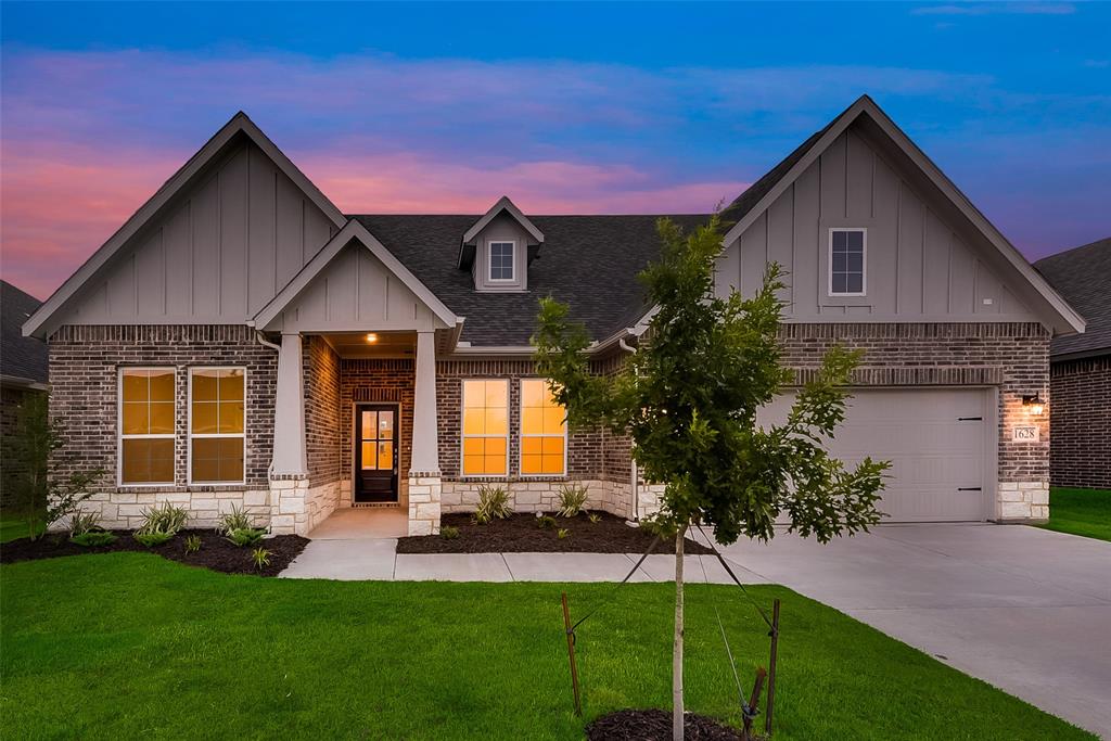 Upon entering the home off the front porch, you’re welcomed by an inviting foyer. Immediately to the left is a hallway with a bedroom, walk-in closet and full bathroom, as well as a linen closet. Across the foyer is a flex room, perfect for a home office, formal dining room or whatever need your family has for the space. Past the foyer is the family entry, with storage space and mud bench, which leads to the laundry room and two or three car attached garage. Through the entrance, the home opens up to a large family room with a stately fireplace. Adjacent to the family room is a gourmet kitchen, equipped with a walk-in pantry, ample counter space and an oversized island. Finishing off this open-concept living area is a dining space which overlooks the covered back patio. The back corner of the home offers privacy for the owner’s suite, featuring a massive walk-in closet and bathroom with a dual-sink vanity, standalone soaking tub and glass-enclosed shower.
