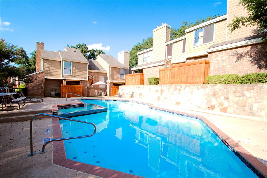 Lovely 2 bedroom, 2 and a half bath, two story condo in well established and quiet Park Willow Condo Complex.  Updated entry and kitchen floor tile as well as engineered hardwoods in living and upstairs hallway along with updated kitchen countertops.  Unit has two HVAC systems, with both recently being replaced in 2025 and 2022.  Floor one includes kitchen, dining area, living, fireplace, full size washer-dryer closet, half bath, and sliding patio door to rear fenced in patio with exterior storage.  Floor two has two bedrooms with full ensuite bathrooms each and plenty of closet and storage space.  HOA fees include water, sewer, trash, exterior maintenance, grounds maintenance, access to pool, pool maintenance.  Grounds include plenty of trees and small green areas with central pool and deck area.  Unit has two assigned parking spaces.  Walking distance to Parkway Central Park, and close to Arlington Entertainment District including the stadiums and ballparks, UTA, restaurants and shopping, with easy access to I-30.
