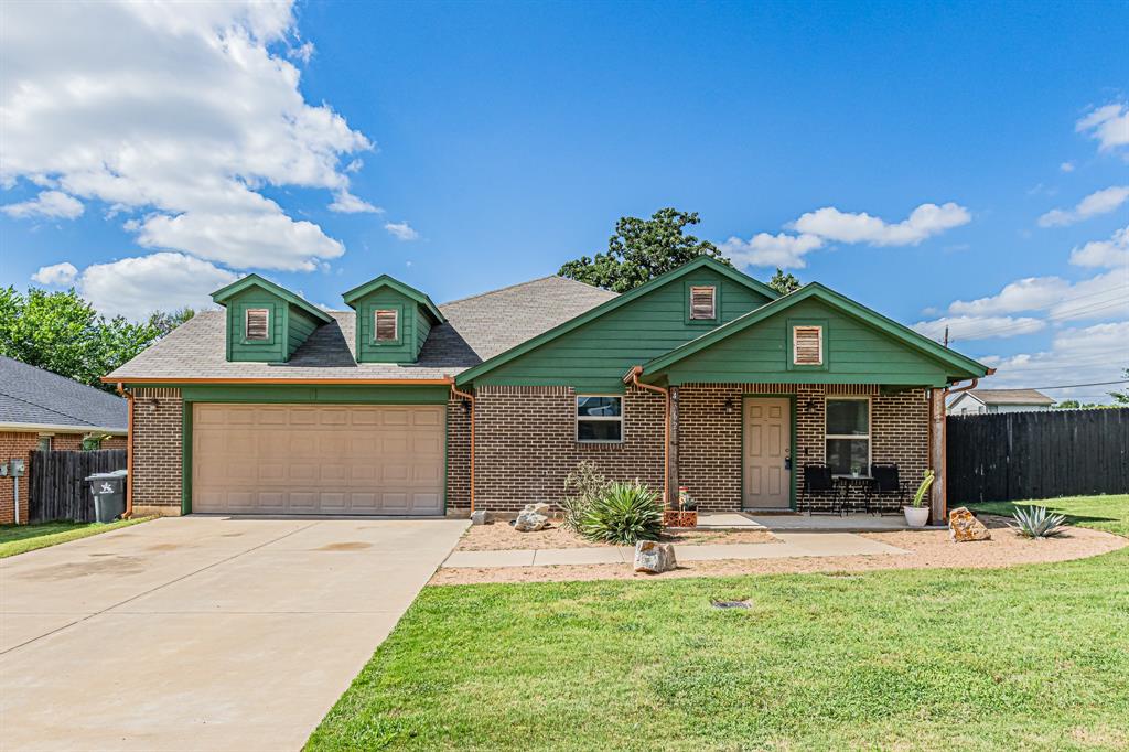 Built in 2019, this 4bedroom, 3bath home offers an open concept floor plan filled with natural light, stained concrete flooring, and a functional layout designed for everyday living and entertaining. The spacious kitchen features a large island with seating, plenty of cabinet storage, and a dry bar that's perfect for a coffee station or beverage center. The kitchen overlooks the living room, creating a seamless flow for gatherings and family time. The living room offers plenty of natural light and is accented by a large ceiling fan. The private primary suite includes a walk-in closet and an ensuite bath with dual sinks and a separate shower. Two secondary bedrooms share a hall bath, while the fourth bedroom enjoys its own private ensuite bath, providing flexibility for guests, multigenerational living, or a home office. Additional highlights include a utility room with a sink and built-in shelving, a covered front porch, and a covered back patio overlooking the large backyard. Situated on a corner lot, this property offers plenty of outdoor space to personalize and enjoy. With room for everyone and all the right updates already in place, this home is move-in ready and waiting for its next owner.