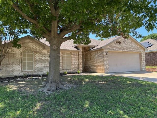 This Beautiful home is waiting for you.  It has b beautiful entry to open Living room that opens to kitchen and dining Room.  Primary Suite is spacious with entry to an inviting Bathroom with Texas sized Bathtub, Separate Shower, with a large Closet. Secondary bedrooms are good sized with Ceiling Fans and an inviting bathroom.  Kitchen offers Stainless Steel Appliances open to Dining Room and Living Room with Pretty Brick Fireplace.  Laundry Room offers additional space next to Kitchen.  Good sized Garage with Opener.  Private backyard is spacious. Solar Screens cover windows facing West to keep the Texas Summers from outdoor sunrays.  Come see this home - you will be pleased with the comfort of a neighborhood that is close to schools, Parks, Shopping and Friendly Texas Neighbors
