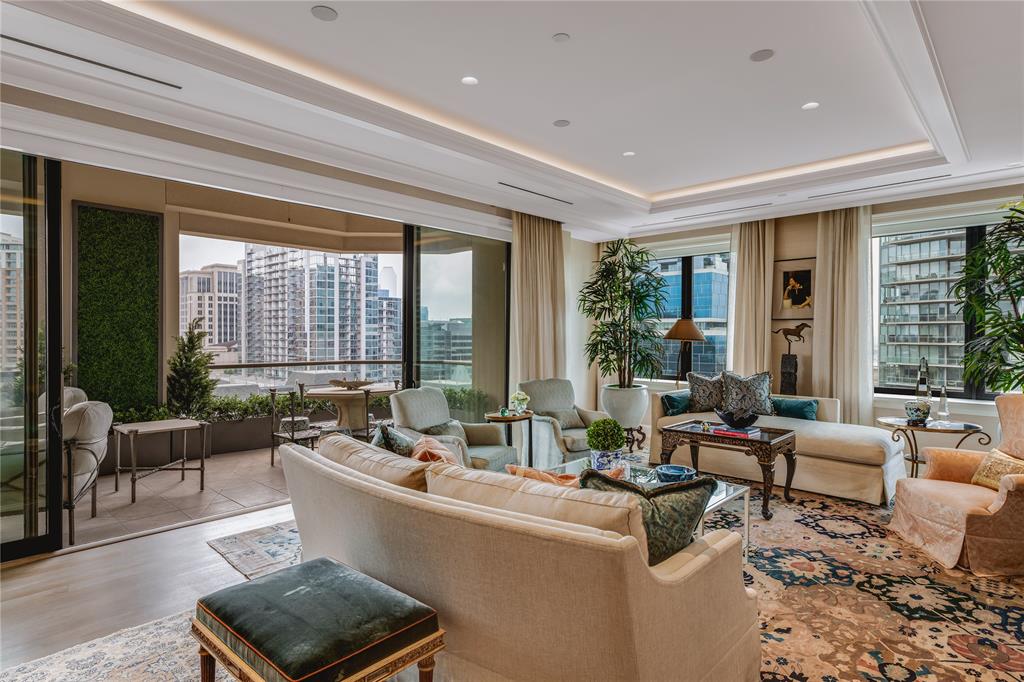 An extraordinary custom residence at the prestigious Stoneleigh, offering expansive refined Uptown luxury living. Designed by renowned architect Mark Finlay, the home features direct elevator access opening to a spectacular Park Avenue-style foyer with lacquered finishes and limestone flooring. The Christopher Peacock kitchen showcases handcrafted cabinetry and Ann Sachs tile, while the spacious primary suite includes dual custom baths with Zanger tile and heated floors. Four landscaped terraces extend the living space outdoors, accessible through hideaway sliding doors. A climate-controlled wine room accommodating 650 bottles, custom storage solutions, and private garage with epoxy floors reflect meticulous attention to detail. French antique hardwood flooring, artistic wallcoverings, and bespoke lighting create an atmosphere of timeless sophistication throughout this one-of-a-kind sky residence.
