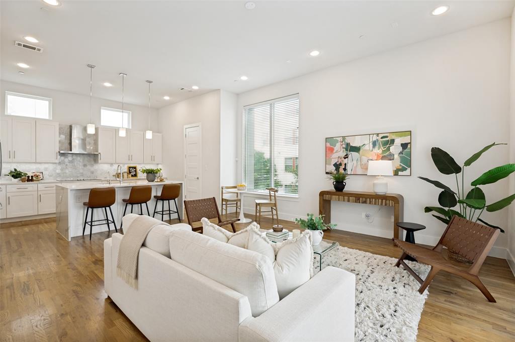 This stylish corner-unit home offers modern design, natural light, and an unbeatable East Dallas location. Situated in a gated community just minutes from Lower Greenville, Henderson Avenue, and Downtown, this home offers the perfect balance of city convenience and low-maintenance living. Inside, soaring 11-foot ceilings, custom white oak floors, and oversized windows create a bright and open atmosphere throughout the main living spaces. The thoughtfully designed floor plan features a dedicated first-floor office, spacious living and dining areas, and a sleek kitchen complete with quartz countertops, a premium Bosch appliance package, and a large island with ample storage space. Upstairs, the spacious primary suite features a sitting area, large walk-in closet with built-in shelving, and an en-suite bath with an oversized walk-in shower. Additional highlights include a second-floor patio, attached two-car garage with epoxy flooring, and direct access to the community dog park. Stylish, functional, and ideally located, this move-in ready home offers the best of city living and everyday convenience.