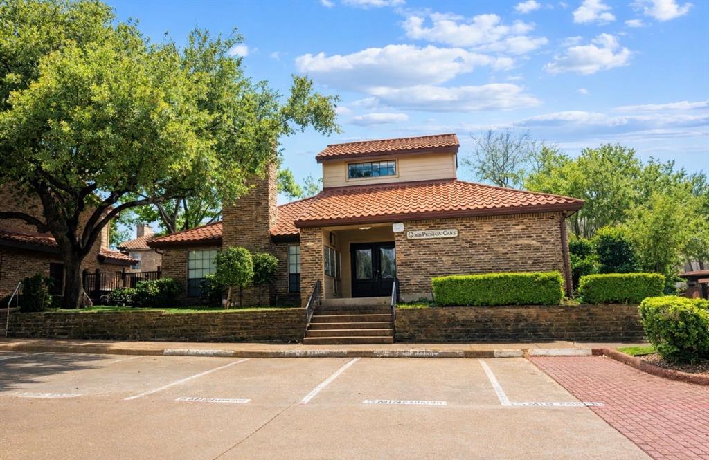 Freshly painted.  Fantastic location.  The pool is just outside your gate. Extremely well maintained.  Kitchen and bathrooms have been updated.  This unit comes with one assigned covered parking space.  Easy care solid surface floors.  Beautiful corner fireplace.  Half bath is located on the first floor.  Upstairs you will find two bedrooms and a full bath. The primary bedroom has a large walk-in closet.  Amazing walkup appeal.  Enclosed private courtyard can easily accommodate patio furniture.  Convenient to a multitude of amenities in Addison with shopping and restaurants just minutes away. This location offers easy access to 635 and North Dallas tollway.