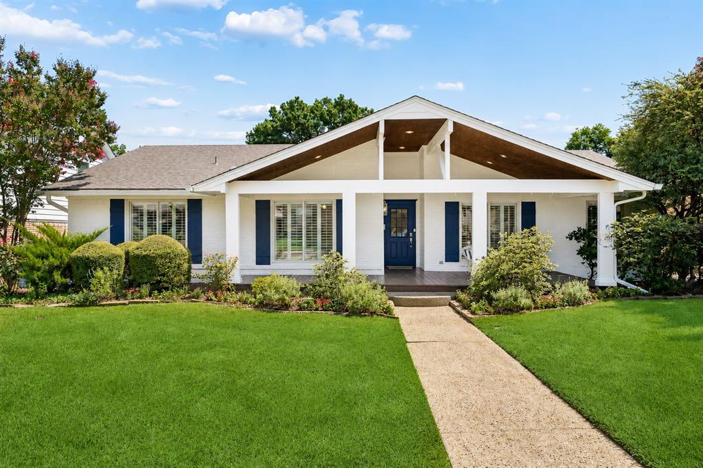 Filled with timeless charm inside and out, this beautifully updated 4-bedroom, 2.1-bath home sits in the heart of Lake Highlands and welcomes you with a truly show-stopping oversized front porch. Inside, a proper foyer opens to elegant formals featuring bay windows, custom built-ins, and abundant natural light. The updated kitchen is both stylish and functional with quartz countertops, a designer backsplash, floor-to-ceiling cabinetry, stainless steel sink, gas range with double ovens, breakfast bar, and sunny breakfast nook. It flows seamlessly into the vaulted family room, where an impressive fireplace and French doors overlook the incredible backyard.

The flexible fourth bedroom, conveniently located off the kitchen, is perfect as a playroom, home office, or guest room. Designed for entertaining, the backyard offers an expansive deck, outdoor living space, lush landscaping, and a private putting green—ideal for football Saturdays, family gatherings, or relaxing evenings at home.

The secondary bedrooms and spacious primary suite are tucked away for privacy. The generous primary retreat features ample closet space and an updated bath with dual sinks, abundant storage, a vanity area, and a walk-in shower. An oversized utility room connects directly to the attached two-car garage for everyday convenience. Additional updates, including newer windows, complete this charming home that's ready for its next chapter.