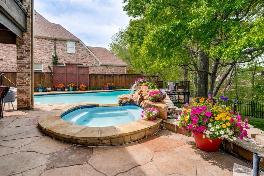 Uniquely beautiful!! Welcome to an exquisite 5 bedroom, 4 bath Melton Custom built home. Where timeless elegance meets modern sophistication. This stunning 4400 square -foot residence set on a perfectly landscaped lot offers unparalleled luxury and thoughtful design at every turn. As you enter you’re greeted by soaring ceilings, rich hardwood floors, and a open concept layout that lends style and functionality. The chefs kitchen is a master piece. Recently painted custom cabinetry, quartz island and walk in pantry. The adjacent family room, bathed in natural light from over sized windows boast a stone floor to ceiling gas fireplace that creates a warm inviting ambiance. The true gem is the wine cellar tucked off the main living area. The primary suite is a spacious retreat with newly remodeled en-suite and large walk in closet. Additional bedroom and bath on lower level. Three bedrooms, two baths upper level with a game room and media room. Outside, enjoy a meticulously landscaped creek lot shaded by pecan and oak trees, lighting with back yard turf. Inviting diving Pool and spa, a separate deck over looking the creek. Patio with fireplace and built in grill for entertaining. Three car garage. This home will not disappoint. All information provided is deemed reliable but is not guaranteed and should be independently verified by agent or buyer