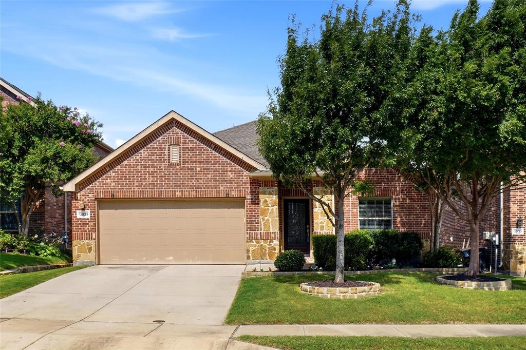 Beautiful one story BACKING TO GREENBELT in the desirable Villages of Woodland Springs subdivision. This Lennar built home greets you with a lovely landscaped front yard, and covered porch. The living area has raised ceilings, a gas starter wood burning fireplace, hardwoods throughout, and ceiling fans. The kitchen boasts granite countertops with tile backsplash, breakfast bar, stainless steel appliances and a plethora of cabinets for storage. The primary suite does not disappoint with a large walk in closet, dual sinks, linen closet, garden tub and separate shower. Two spacious secondary bedrooms, sharing a secondary bath with shower tub combo. Nice sized separate utility room. Huge 15 x 17 patio is perfect for a family barbeque, with ample room for living and dining space. You have a great view of the greenspace, complete with a fantastic pergola covering the entire patio. The large backyard has plenty of room for pool, pet or play. Radiant barrier, Low E double pane windows, 16 Seer AC unit. KELLER ISD