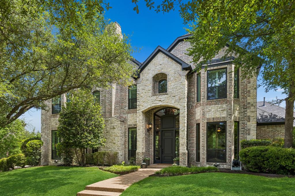 Stunning custom home located on a private one-acre lot in the highly sought-after Oakwood Estates in Lovejoy ISD. Cul-de-sac setting with circle drive, lush landscaping, and mature trees surrounding the property for ultimate privacy. Inviting two-story foyer with immediate views to the tranquil backyard beyond. Elevated architectural design with soaring ceilings, gorgeous hardwood floors, detailed moldings, solid core doors, plantation shutters, and quality craftsmanship throughout. Double doors lead to the executive office featuring custom woodwork, built-in shelving, and coffered ceiling. Formal living with fireplace and spacious formal dining perfectly suited for intimate gatherings or entertaining on a grand scale. Natural light fills the family room with soaring vaulted ceilings, grand fireplace, custom built-ins, charming window seat, wet bar with built-in wine fridge, a wall of windows overlooking the outdoor living area, pool, and access to your private backyard retreat. The family room flows seamlessly to the breakfast room and gourmet kitchen featuring a large center island with extensive prep and serving space, breakfast bar seating, commercial-grade 6-burner gas range, Sub-Zero refrigerator, double ovens, and walk-in pantry. The oversized primary suite is tucked away with fireplace, sitting area, and spa bath with extensive counter space, separate vanities, vaulted ceilings, frameless glass walk-in shower, and expansive closet. Additional first-floor guest suite with full bath positioned for privacy. Upstairs game room conveniently separates two large bedrooms, each with ensuite bath and walk-in closet. Abundant storage throughout. Outdoor oasis with pool, patio, and multiple areas to relax or entertain surrounded by mature trees for complete privacy. Prestigious Oakwood Estates offers a serene luxury setting just minutes from premier shopping, dining, and everyday conveniences. Recent updates include new roof, gutters, exterior paint, all new windows.