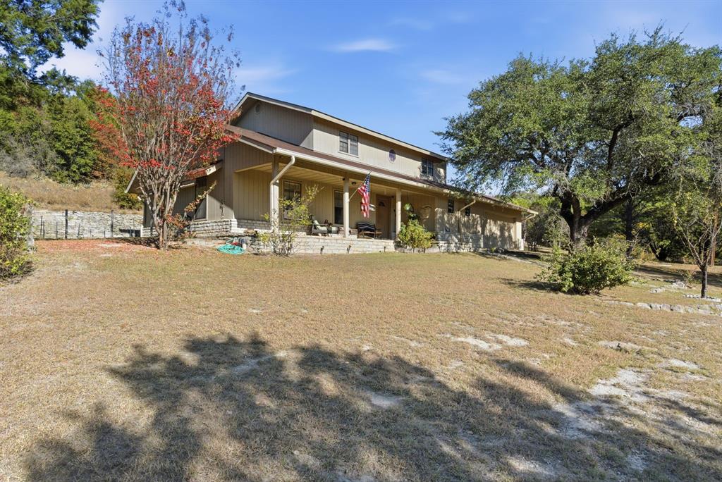 Modern Farmhouse on 4.5 Acres Between Lipan and Granbury!
Experience serene country living minutes from both Lipan and Granbury in this custom-built, two-story modern farm-style home with approximately 2,200 square feet of quality craftsmanship. Set on a wooded 4.5-acre tract with mature trees and natural elevation changes, this property offers seclusion without sacrificing convenience to Granbury’s shopping, dining, lake, and amenities. Located in highly regarded Lipan ISD, 
this unique property features an attractive rock and siding exterior, with covered porches, a bright open-concept living and dining area complimented with plenty of natural lighting and room to entertain guests and host family get togethers.  

Property Features

4.5 acres of wooded privacy with rolling terrain and native landscaping
Versatile outbuilding currently used for storage and guest quarters
Plenty of space for a shop, barn, garden, or expanded outdoor living area
Room for trails, pets, and play
Privacy from FM-4 and the neighbors