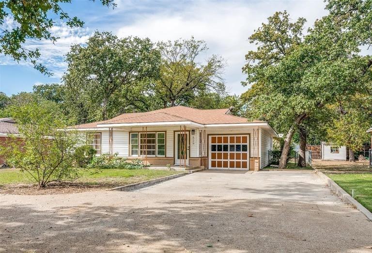 529 Roberts Cut Off Road has the kind of character that newer construction simply doesn't offer. Built in 1952, this 3-bedroom, 2-bath home in River Oaks has real hardwood and tile floors, solid walls, and a layout that makes good use of its 1,311 square feet — nothing feels cramped or wasted. The 1-car garage is a practical everyday bonus, and the backyard is genuinely spacious — Huge mature trees, flat, grassy, and ready for whatever you want to do with it. River Oaks sits right next to Fort Worth, so you get a quieter, established neighborhood without being far from anything. Zoned to Castleberry ISD and move-in ready. Come take a look!