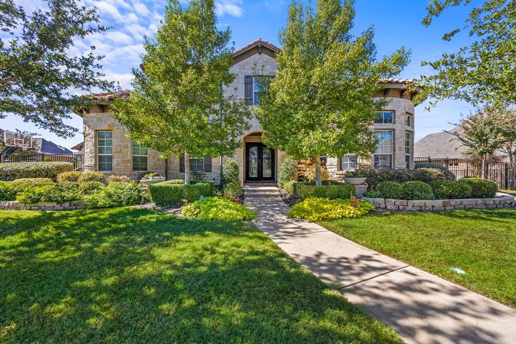 Welcome home to this beautiful family home in the heart of Southlake!  Located in the highly desirable neighborhood of Shady Oaks, this home sits on a half acre & lushly landscaped interior private lot. Boasting 5 spacious bedrooms, 7 baths and an oversized 4 car garage, this gem is a rare find!  An impressive wood staircase greets you upon entering the home to find beautiful hardwood floors and soaring ceilings. The private, oversized, and well-adorned Study boasts wood floors, custom shelving for display and cabinetry.  The spacious Formal Dining room is open to the Foyer and features an upgraded Wine Grotto equipped with a large wine refrigerator and beautiful custom cabinetry. The recently updated Chef's Kitchen and Great Room are perfect for family and entertaining. An expansive Kitchen island with quartzite countertops, new backsplash, new sink, faucet and hardware, tons of cabinetry, plus a separate prep area, Butlery and hidden walk-in Pantry serve all of your needs. Enjoy the outside while indoors with walls of folding doors to the covered patio. Step away from the day to the Primary Suite with a spacious bath retreat area and separate custom closets. In addition, the 1st floor has a separate Guest Suite,  oversized laundry room that doubles as another prep area or craft room, and a quiet Media Room with updated designer lighting, Upstairs you will find a large Game-Play room with a serving Bar and a private balcony looking over the lush yard and pool, along with 3 oversized Bedrooms all with en-suite Baths.  The backyard has it all with an attached patio, fireplace, serve bar with refrigerator and 2 tv areas, all with motorized shades. A Separate covered Outdoor Living center has a professional grade grill and green egg, plus an additional fireplace alongside a gorgeous Claffey pool and spa area!  This home has it all! 4 car garage!  Designer lighting throughout! Incredible floor plan!