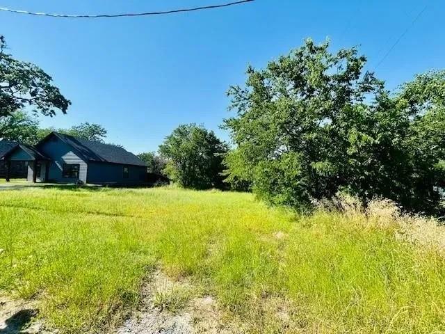 Oversize 8,999 sq ft residential lot at 129 E Johnson St in Denison offers a rare opportunity to build a custom home just minutes from Historic Downtown. Level and usable, ideal for a single-family residence, modern cottage, or investment build. Single Family Residential (SF-5), supporting traditional neighborhood-style development on an oversized city lot compared with many in-town parcels, offering flexibility for a larger floor plan, outdoor living space, or additional parking (subject to city approvals). Bring your plans and vision—this ready-to-develop lot is a great canvas for your next home or investment project in Denison.