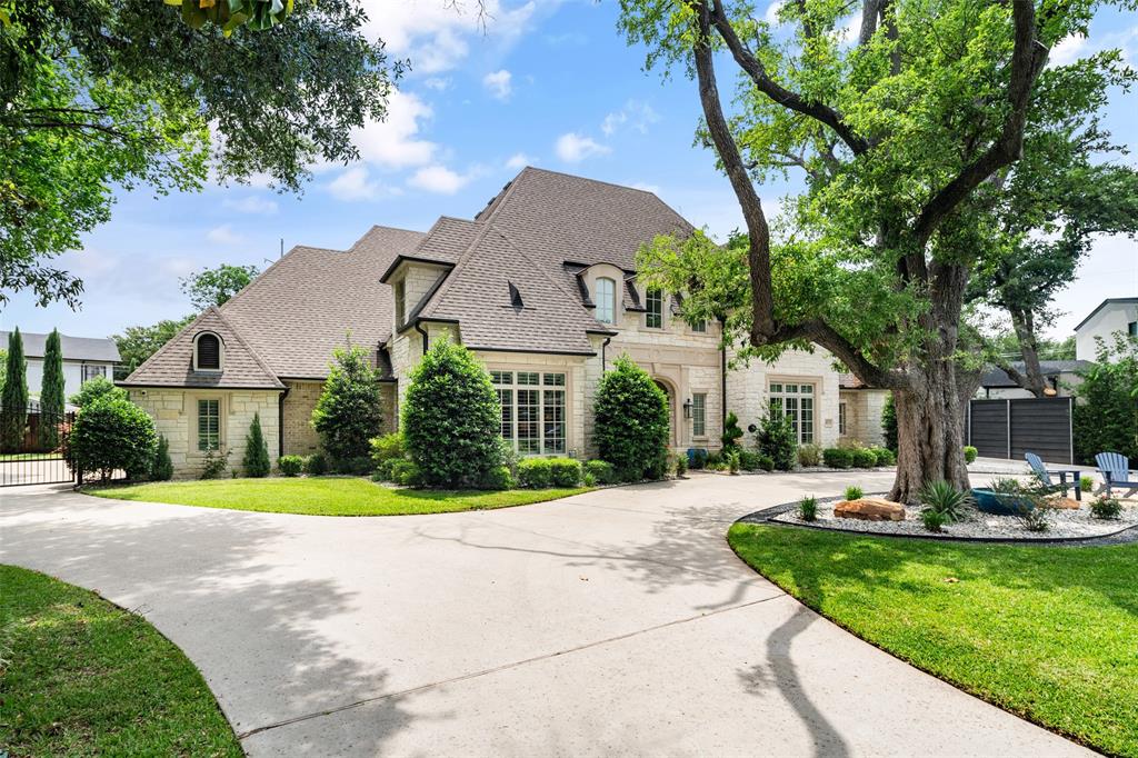 Nestled in Dallas's coveted private school corridor, this stunning .57-acre estate at 4674 College Park Drive offers the lifestyle you've been dreaming of. This 6-bed, 8-bath French Traditional masterpiece spans 6,518 sq ft of refined living. The chef's kitchen stuns with double islands, Sub-Zero & Wolf appliances, and a generous butler's pantry and bar built for entertaining. It is rare to find three bedrooms downstairs — including a flexible third perfect as an in-law suite, home gym, or private office. Each bedroom boasts an en-suite bath and plenty of closet space. The garage features two electric car charging plugs and an RV hookup for the ultimate in modern convenience. Step outside to your personal resort: sparkling pool, lush lawn, and a covered patio with remote control screens, built-in grill, fireplace, and bar. Every evening becomes an event. This is more than a home — it's where your story begins.