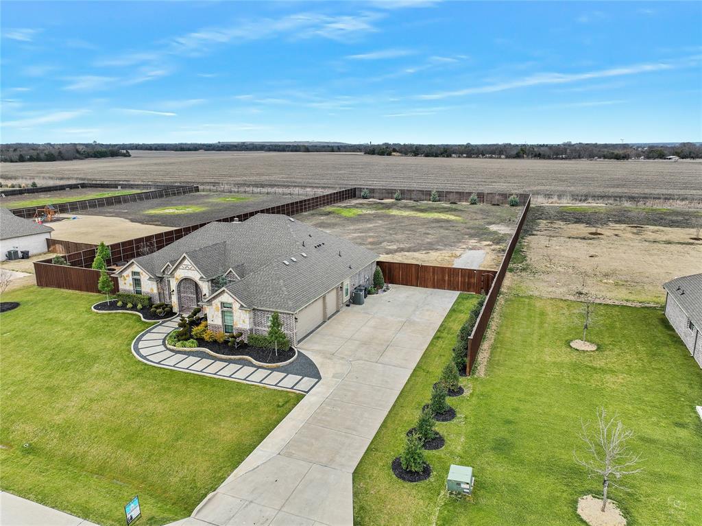 Extremely Low Property Taxes! 6309 Starr Drive, McKinney, TX 75071. Recent Price Reduction! Stunningly landscaped and move-in ready.

No neighbors behind you! Yes, you can have chickens. Over 1 Acre!

Welcome to your private retreat on 1.181 acres in McKinney ISD with a low 1.33% tax rate.

This beautifully maintained property offers a wonderful combination of thoughtful upgrades, functional improvements, and outdoor living designed for the Texas lifestyle.

The recently painted interior feels fresh and inviting, complemented by updated light fixtures, enhanced bathroom mirrors, and ceiling fans in the bedrooms for added comfort and efficiency.

Outside, the curb appeal stands out. Professionally designed natural stone flower beds enhance the front elevation, while established landscaping provides beauty and natural privacy. A modern sidewalk adds both character and functionality, and upgraded exterior lighting highlights the home's appearance in the evenings.

The extended driveway offers generous parking, while gutters and improved drainage systems in the front and side areas provide effective water management throughout the year.

Step into the spacious backyard designed for relaxation and entertaining. Enjoy evenings under the covered patio featuring a warm wood ceiling, or tend to the dedicated vegetable garden area complete with its own irrigation system. Additional irrigation supports trees and key landscape areas, promoting long-term health and balance through every Texas season.

This is more than a home—it's a thoughtfully upgraded property with space to breathe, grow, and entertain.