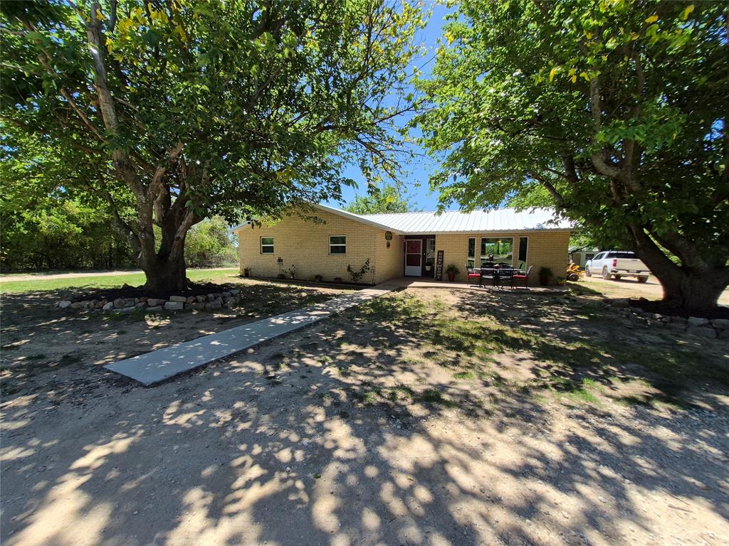 Appraisal in hand! $5,000 towards buyer closing cost!
 Located in Clyde school district - Charming 3-bedroom, 2-bath home on acreage. This property offers the perfect blend of country living with convenient access to I-20, making it ideal for commuters or potential business use.
Recent updates include brand new windows and a new HVAC system installed in 2021, providing comfort and energy efficiency. The property features a shop, RV cover, and a separate home office—perfect for remote work, hobbies, or a small business setup.
Enjoy outdoor living on the covered back porch overlooking a fenced backyard, ideal for pets or entertaining. The land includes a working water well, a tank at the back of the property, and mature peach, pear, and pecan trees that add both beauty and functionality.
Don’t miss this versatile property with room to grow, work, and enjoy peaceful country living just minutes from town. 
OWNER-AGENT.