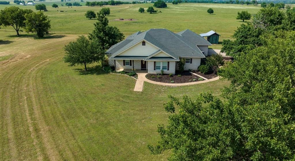 Location, Location, Location! Developers welcome! No known restrictions and minerals negotiable. Also great for personal use,  this stunning white brick custom home is surrounded by over 75 rolling acres of north Texas hill country and is now available in the small yet rapidly growing town of Valley View. This property poses a great opportunity for anyone, whether looking for a place to raise a family, rancher wanting to operate a farm and ranch, or an investor looking for the perfect development acreage. The beautiful 3 bdrm 2.5 bath 2 car grg home was custom built in 2005 , boasts timelessly crafted cabinetry, elegant granite countertops, and etched acid stained flooring throughout. Conveniently situated on an FM road only a couple miles from the booming I35 growth corridor, this property has huge investment potential, don't miss out!