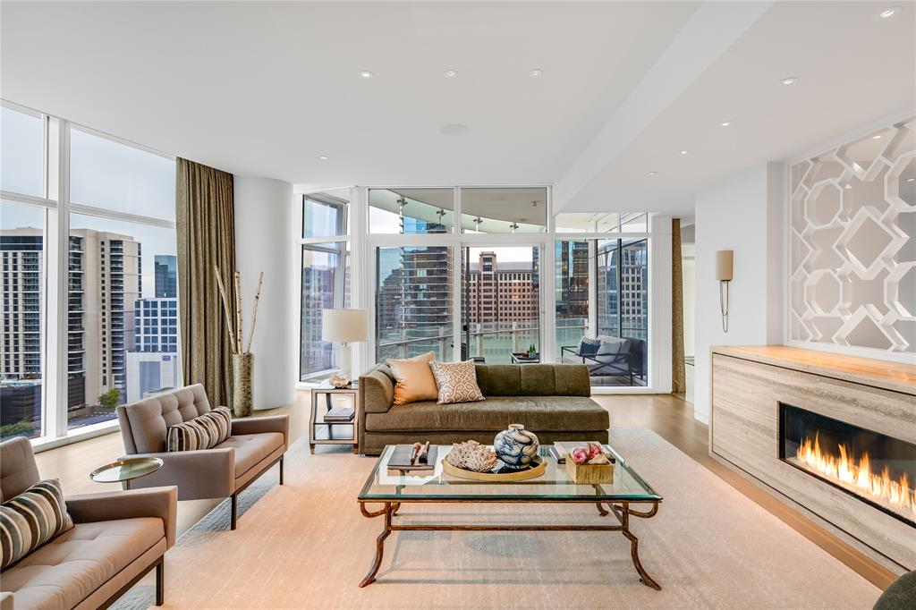 Located in the center of the Dallas Arts District, Museum Tower is the most prestigious address on Klyde Warren Park.  A rare, North end cap home features a private elevator that opens directly into your home.  The elevator delivery is EXCLUSIVE to Museum Tower as each ride is private.  Floor to ceiling windows, motorized shades, custom PoggenPohl gourmet kitchen with Miele appliances opens to a grand living dining space w stunning unobstructed views of downtown Dallas.  The sizable primary suite features walk in closets, dual sinks, separate shower, balcony access, and a separate office.  Custom draperies, Crestron automation system, gas fireplace and 3 parking spaces.  Exception custom build!