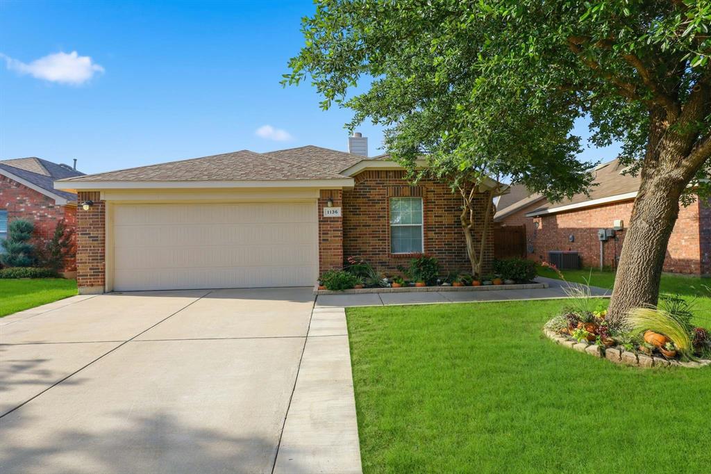 Welcome to 1136 Kachina Lane in Sendera Ranch. This well-maintained single-story home offers 4 bedrooms, 2 full baths, and an open-concept layout designed for both everyday living and entertaining. The spacious living area features a cozy fireplace and flows seamlessly into the dining space and kitchen, complete with abundant cabinetry, generous counter space, breakfast bar seating, and a refrigerator that conveys with the home. The private primary suite is thoughtfully separated from the secondary bedrooms and includes an ensuite bath with a separate tub and shower, dual sinks, and a walk-in closet. Three additional bedrooms provide flexibility for guests, a home office, playroom, or workout space. Enjoy a fully fenced backyard with plenty of room for outdoor activities, pets, or weekend gatherings. Conveniently located within Northwest ISD and just minutes from shopping, dining, and major commuter routes, this move-in ready home offers exceptional value in one of the area's most desirable communities.