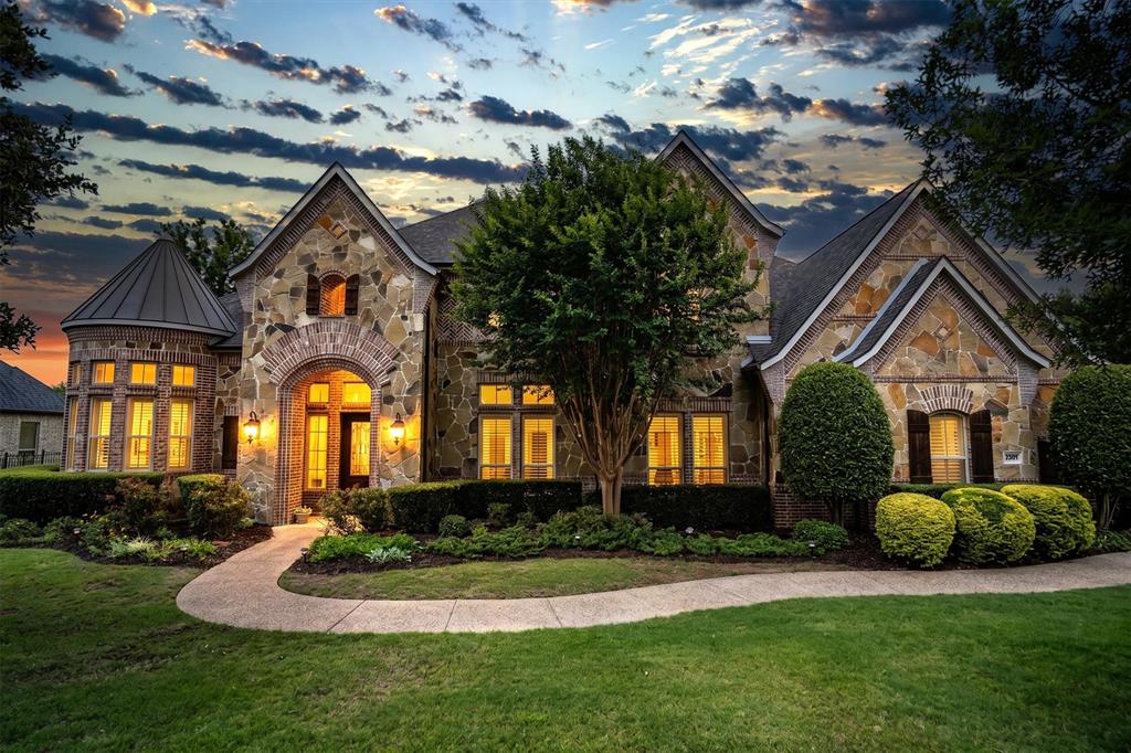Experience refined living in the heart of Flower Mound’s prestigious Bella Lago community, where luxury, privacy, and lifestyle come together on a beautifully landscaped 1-acre estate just north of Lake Grapevine. This expansive 5-bedroom, 6-bath custom home blends timeless elegance with the flexibility today’s buyers desire. From the executive study-library with custom built-ins to the dedicated media room, dual staircases, formal dining space, versatile bonus room, & oversized upstairs game room complete with its own mini kitchen, every space was thoughtfully designed for elevated living & effortless entertaining. At the center of the home, the chef’s kitchen impresses with double ovens, a commercial-grade range & vent hood, built-in refrigerator, oversized island, butler’s pantry, built-in wine closet & seamless flow into the main living areas—creating the perfect setting for everyday living and entertaining. The private primary suite offers a true retreat with a stunning wall of bay windows overlooking the property, along with a spa-inspired bath featuring a clawfoot jacuzzi tub, dual-shower heads, & spacious his-and-her closets. Rich hand-scraped hardwood floors, plantation shutters, granite finishes, travertine floors, brand-new carpet, & exceptional craftsmanship throughout create a warm yet sophisticated atmosphere. Additional highlights include a spacious 4-car garage, cedar closet, & an oversized walk-in decked attic, offering exceptional storage rarely found in today’s luxury homes. Step outside to your own resort-style backyard featuring a sparkling pool, attached spa, covered patio, outdoor fireplace, organic garden, and multiple spaces designed for relaxing or entertaining under the Texas sky. Located in one of Flower Mound’s most sought-after luxury communities, Bella Lago offers the rare combination of estate-style living, upscale amenities, and convenient access to top-rated schools, Coram Deo, premier shopping and dining, and Lake Grapevine.