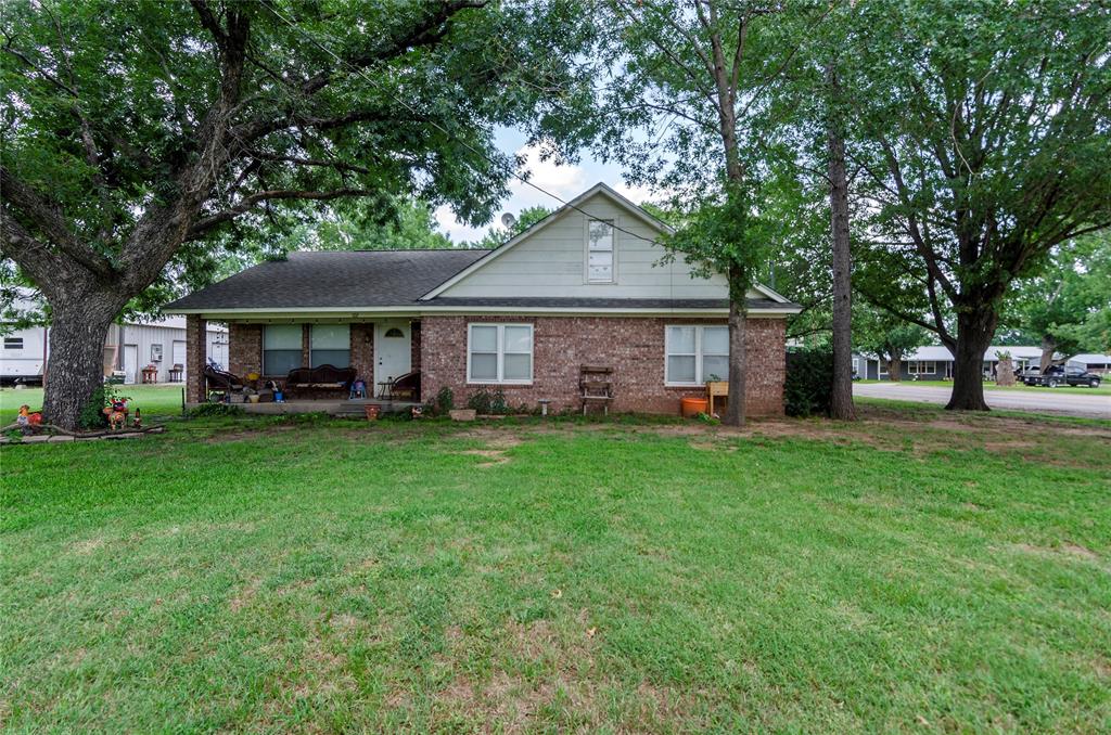 HUGE INVESTMENT POTENTIAL IN THE TOWN OF PARADISE. Here is your chance to own a large, 4 bedroom single-family home (currently a rental) with a large shop on prime development acreage just off of Highway 114. This property is offered separate from, or in addition to a large portfolio of nice rental properties located directly across the street on Ash. This home with the additional level and cleared acreage can be yours for a home-based business or to build multiple homes on-a family compound or simply for income properties. The current owner is a developer and has preliminary plans for fourplex townhomes that could be built on the acreage adjacent to the home and he is willing to share and even build these structures if a new owner desires. This is certainly not the only potential use of this property. House is large, but somewhat dated, and does have need of some deferred maintenance. Still, the corner access just off the highway and FM3259 will be conducive for easy access and a multitude of housing configurations. Come and see! If your client is looking for a large rental portfolio on the other side of the street to have in addition to this property, see 102 N Mesquite - MLS#21071514.