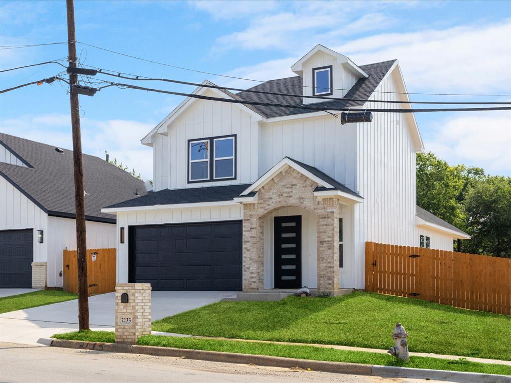 Welcome to this stunning 4-bedrrom, 2.5 bath modern New Construction offering over 2,000 square feet of beautifully designed living space. From the moment you enter, you'll appreciate elegant wood-look flooring that flows throughout the home, plus 10-foot ceilings! The spacious kitchen is a true centerpiece, featuring striking hexagon-pattern backsplash tile, sleek black granite countertops, abundant cabinetry, and stylish chandeliers. The living room and primary suite showcase custom accent walls, living room also includes a fireplace! The luxurious primary retreat includes a massive walk-in closet with integrated shelving designed for shoes, purses, and accessories, as well as a spa-inspired bathroom with dual sinks and ample space. A second full bathroom also offers double sinks, providing convenience for family and guests. Step outside to enjoy the fully fenced backyard, complete with a private gate entrance, covered patio, and welcoming front porch-perfect for relaxing. This home is the perfect blend of modern elegance and everyday comfort. Schedule your showing today!