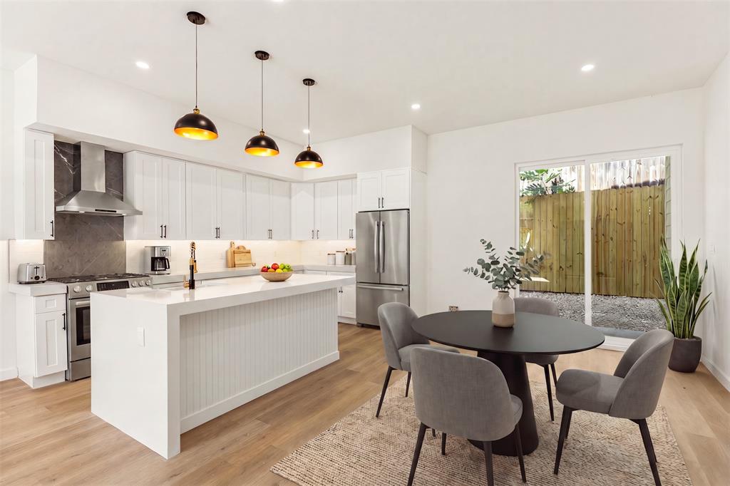 Experience modern luxury in this stunning contemporary new build located in the heart of Dallas. This impressive multi-level home offers 5 bedrooms, 3 baths, and a thoughtfully designed floor plan blending sleek architecture with functional living spaces. From the striking curb appeal with clean modern lines and expansive windows to the upscale interior finishes, every detail was designed to impress.
Step inside to soaring ceilings, an open-concept layout, and abundant natural light throughout. The chef-inspired kitchen features quartz countertops, custom cabinetry, designer lighting, a large waterfall island, and plenty of prep and storage space—perfect for entertaining. The spacious living and dining areas flow seamlessly together with luxury vinyl flooring and contemporary finishes throughout. The private primary suite offers a spa-like retreat with a luxurious ensuite bath and oversized walk-in closet. Additional bedrooms provide flexibility for guests, office space, or multi-generational living. Enjoy multiple outdoor living areas including a balcony and an incredible rooftop deck with panoramic city views—ideal for relaxing evenings or hosting guests. Conveniently located near Downtown Dallas, Bishop Arts District, Trinity Groves, and the Dallas Zoo, with quick access to major highways, dining, shopping, and entertainment. This move-in ready modern masterpiece combines style, comfort, and prime city living all in one exceptional home.