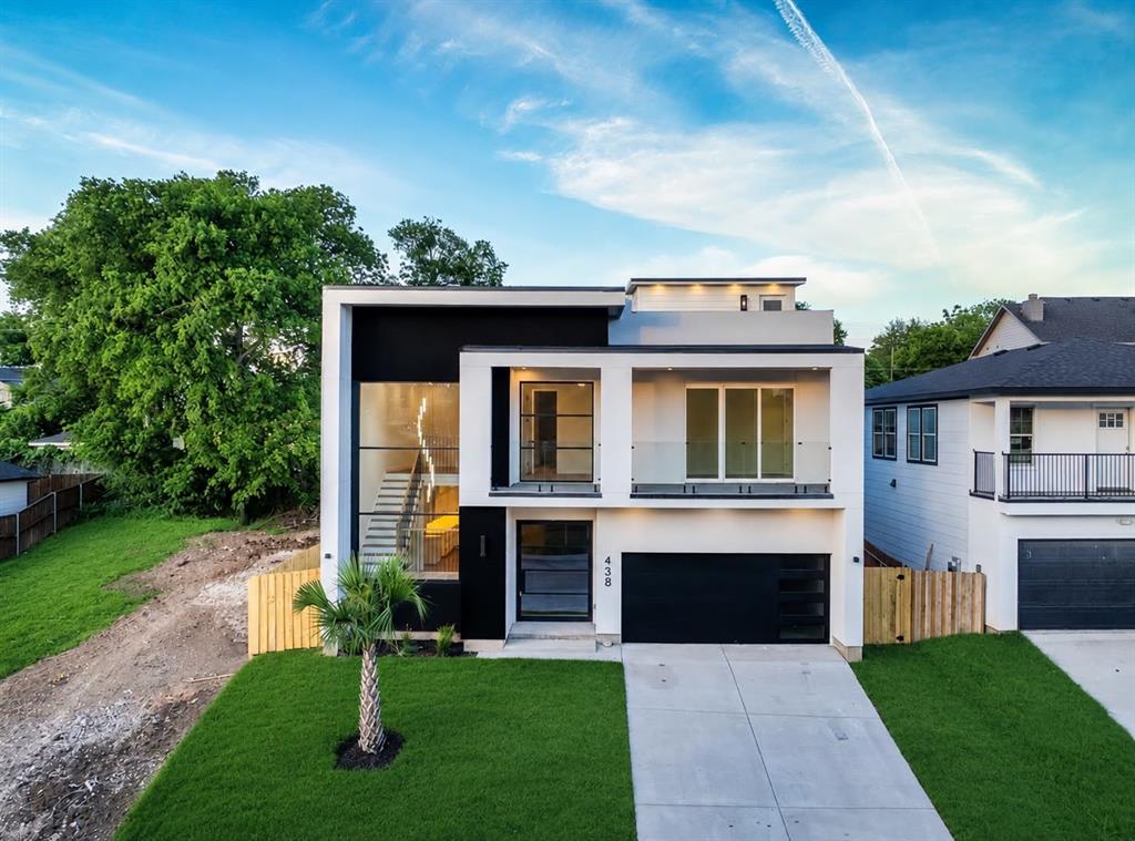 Experience modern luxury in this stunning contemporary new build located in the heart of Dallas. This impressive multi-level home offers 5 bedrooms, 3 baths, and a thoughtfully designed floor plan blending sleek architecture with functional living spaces. From the striking curb appeal with clean modern lines and expansive windows to the upscale interior finishes, every detail was designed to impress.
Step inside to soaring ceilings, an open-concept layout, and abundant natural light throughout. The chef-inspired kitchen features quartz countertops, custom cabinetry, designer lighting, a large waterfall island, and plenty of prep and storage space—perfect for entertaining. The spacious living and dining areas flow seamlessly together with luxury vinyl flooring and contemporary finishes throughout. The private primary suite offers a spa-like retreat with a luxurious ensuite bath and oversized walk-in closet. Additional bedrooms provide flexibility for guests, office space, or multi-generational living. Enjoy multiple outdoor living areas including a balcony and an incredible rooftop deck with panoramic city views—ideal for relaxing evenings or hosting guests. Conveniently located near Downtown Dallas, Bishop Arts District, Trinity Groves, and the Dallas Zoo, with quick access to major highways, dining, shopping, and entertainment. This move-in ready modern masterpiece combines style, comfort, and prime city living all in one exceptional home.