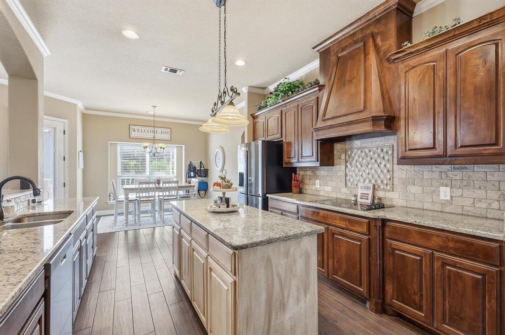 Welcome to an exceptional residence set on a sprawling 1.3-acre cul-de-sac lot, offering the perfect blend of privacy, space, and refined living. With no HOA and no city taxes, enjoy the advantage of remarkably low property taxes (owner only pays $5,600 a year) while embracing a lifestyle of freedom and flexibility. This rare property also features unique zoning, allowing the owner to choose between Midlothian or Waxahachie ISD.

From the moment you step inside, you’ll notice the elevated craftsmanship, including 10 ft high ceilings with elegant tray ceilings, crown molding, and ceramic wood-look tile that flows seamlessly throughout the main living areas. The gourmet kitchen is designed to impress, featuring granite countertops, an expansive island, and abundant space for both everyday living and entertaining.

The thoughtfully designed floor plan offers 4 spacious bedrooms, a dedicated office, and 3 full bathrooms, with walk-in closets in every bedroom. A large utility room provides exceptional functionality with ample space for organization and storage. Window blinds are installed throughout for added convenience.

The expansive living room creates a warm and inviting atmosphere, while the upstairs game room offers a versatile space for entertainment or relaxation. Step outside to a generous deck, perfectly suited for hosting gatherings or enjoying peaceful evenings overlooking your private acreage.

Designed with efficiency in mind, the home is equipped with spray foam insulation to help maintain comfort year-round while keeping utility costs low.

This home is a rare opportunity to experience elevated living with the space, features, and location to match.