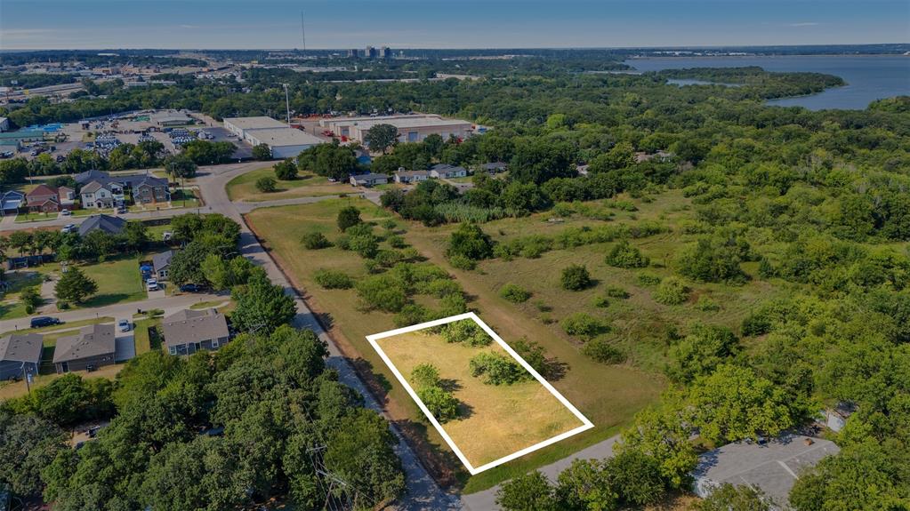 Prime Corner Lot with Multi-Family & Single-Family Zoning – Investor Opportunity Don’t miss this exceptional opportunity to own a versatile corner lot in a rapidly developing area poised for transformation into a vibrant, walkable neighborhood. This property is zoned for both a multi-family and single-family residence, offering flexibility for a variety of residential or investment strategies. Whether you're an experienced investor or just starting out, this lot provides the perfect foundation to build income-generating units or a custom home with additional rental potential. With new infrastructure and community-focused development on the horizon, property values are expected to rise, making this an ideal time to invest. Conveniently located with easy access to major roadways, schools, parks, and shopping, this lot offers long-term value in a growing community.