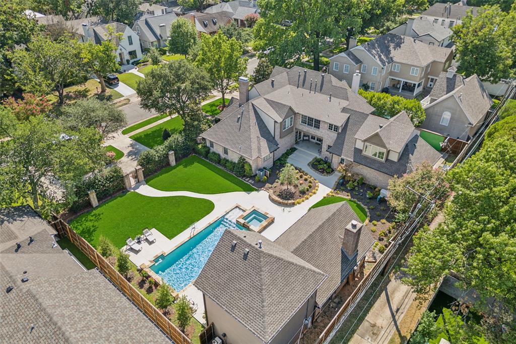 Nestled in the heart of Lakewood Proper, this exquisite property spans 0.44 acres & boasts a 4690 sqft main house along w 1030 sqft guest quarters. The main house welcomes guests with stunning entryway featuring framed ceiling & exposed beams, leading into formal living & dining rooms. Chef's kitchen, equipped w built-in sub-zero fridge, viking gas stove, ample counter space, & pantry, opens to breakfast room w butlers pantry & cozy den w views of lush back lawn & pool. 1st floor primary bedroom suite includes GFP, large walk-in closet & ensuite bath w dual vanities, separate shower & oversized jetted tub. Upstairs you'll find an office, 4 additional bedrooms & 3 full bathrooms. Outdoors, the property is an entertainer's dream w pool featuring basketball hoop & hot tub, covered patio w built-in gas grill & WBFP & spacious guest quarters complete w kitchenette & living area. Additional amenities include home generator, 3-car garage, large circle drive & full-size laundry room w cubbies.