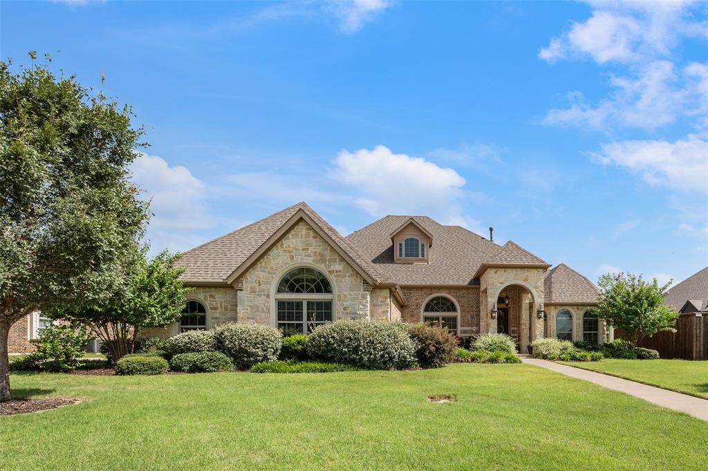 Imagine evenings on the screened patio while the kids play in the oversized backyard. This beautiful Shady Shores custom-built home in the highly desirable Adkisson Ranch, can offer such a dream. Situated on an oversized, tree-lined lot, this thoughtfully designed custom home offers the perfect blend of comfort, privacy and convenience. The split-bedroom floor plan provides a private retreat for the primary suite. Custom details throughout the home include a barrel-vault foyer ceiling, clerestory windows in the living room and primary suite, and an abundance of natural light. The gourmet kitchen features built-in stainless steel appliances, granite countertops, custom wood cabinetry with accent lighting, a large island, two pantries with one of the pantries that is huge, and Butler’s pantry with beverage cooler. Enjoy year-round outdoor living with a fully screened patio, pergola, wood deck, and spacious backyard shaded by mature trees. Additional upgrades include owned solar panels to make your electric bill small or non-existent, tankless water heater, brick front porch, upgraded front door, and an oversized walk-through 3-car garage with epoxy floors and sink. Located within walking distance of the elementary and middle schools and just a short drive to Lake Lewisville marinas, this home also offers convenient access to Denton, Lewisville, Frisco and Dallas. A rare opportunity to enjoy custom craftsmanship, exceptional outdoor living, and a family-friendly location all in one remarkable home.