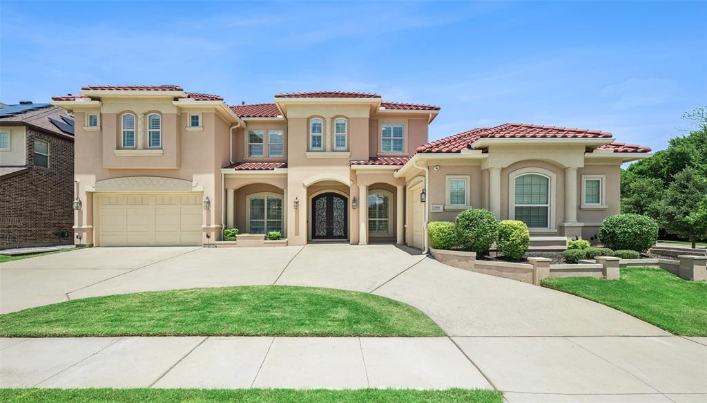 Experience luxury living in this stunning John R. Landon Signature Series semi-custom home located in the prestigious guarded Lexington community of Frisco. Situated on a desirable corner lot with a semi-circular driveway, this exceptional residence combines elegant design with thoughtful upgrades throughout. The grand living room showcases 20-foot soaring ceilings, dual staircases, upgraded hardwood floors, plantation shutters, and a whole-home fire sprinkler system. The chef's kitchen is equipped with a Sub-Zero refrigerator, 6-burner Electrolux cooktop with pot filler, GE Café double ovens, hidden spice racks, dual pantries, soft-close drawers, and abundant storage. A whole-house water softener adds everyday convenience. The oversized primary suite offers private backyard access and a spa-like bath featuring a soaking tub, oversized walk-in shower with floor-to-ceiling tile, separate vanities, dedicated workout area, and expansive his-and-her closets. Designed for entertaining, the downstairs media room includes built-in surround sound, projector, screen, wet bar, and refrigerator—all conveying with the home. The main level also features a private office and formal dining room. Upstairs, you'll find three secondary bedrooms, each with its own bathroom, plus a spacious game room. Additional highlights include a hail-resistant tile roof and two garages with a Tesla charger. Enjoy year-round outdoor living on the extended covered patio featuring electronic screens, built-in refrigerator, sink, and high-heat burner grill. Ideally located near award-winning Frisco ISD schools, including Independence High School, and just minutes from shopping, dining, and major thoroughfares. Residents enjoy exclusive community amenities including a clubhouse, fitness center, resort-style pool, parks, and greenbelt trails.
A rare opportunity to own an exceptional luxury home in one of Frisco's most sought-after communities.