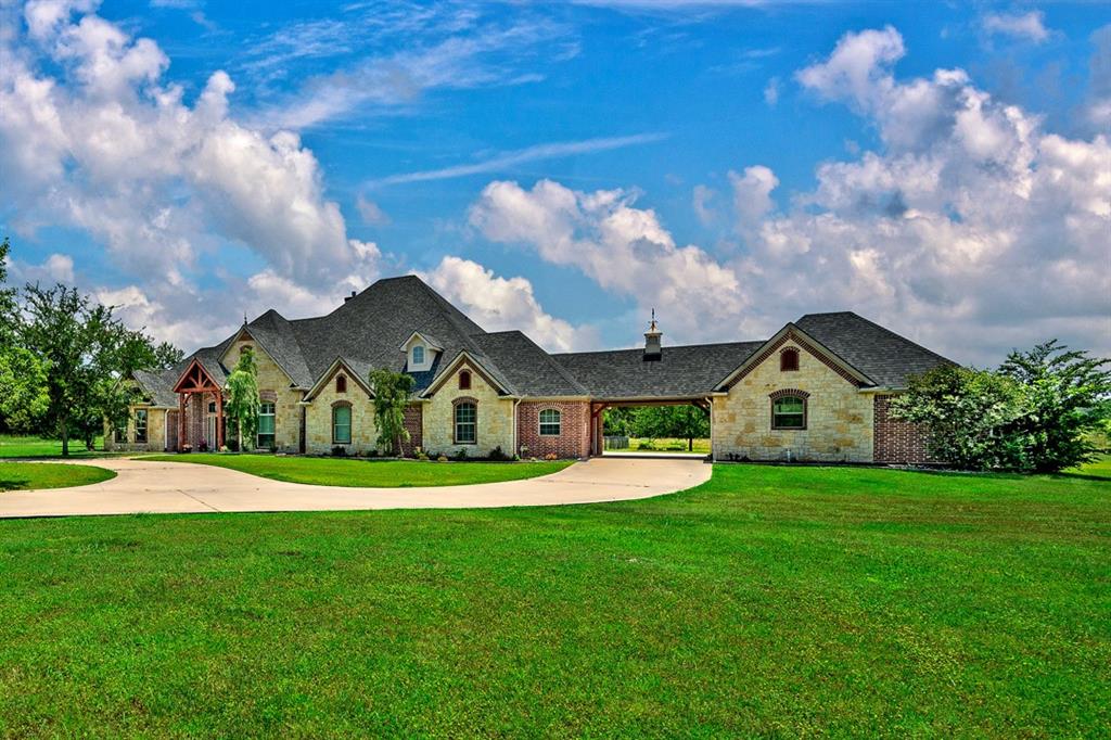 Spacious custom built home on 6.3 acres. Serene country setting within the city limits....This quality five bedroom, seven bath home boasts high end appliances, wood flooring throughout, surround sound, wet bar and bonus room with full bath that could serve as another bedroom....The detached extra 2 car garage (connected by a covered breezeway) has been updated with stained concrete floors, kitchen counter with sink, ensuite heat and air could be used as a gym, game room or man cave....Enjoy the country setting on the large covered patio that includes a built in grill...The in ground pool features a waterfall and fun activities for the kids or grandkids such as a basketball goal, water slide and diving board are just steps away!!!! You can warm up in the spa or by the fire pit.....This home has it all..... Come slow down in small town living, near Lake Texoma yet only ten minutes to US Hwy 75 and points south......