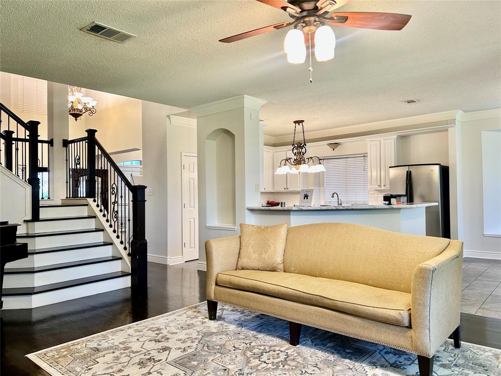 Welcome to this beautifully refreshed 5 bedroom home in Ryan Ranch Estates, offering space, updates, and an excellent south Denton location. Priced at $469,990, this spacious home features 3,027 square feet, 5 bedrooms, and 2.5 bathrooms, making it ideal for families, first time buyers, or relocation clients seeking comfort and convenience.

The home has been freshly painted throughout in 2026, creating a bright and modern feel from the moment you enter. The downstairs bedroom now features brand new carpet, providing a flexible space perfect for guests, a home office, or multi generational living.

Step into the welcoming foyer where high ceilings and crown molding create an impressive first impression. The open living area is filled with natural light and anchored by a cozy wood burning fireplace, making it perfect for both everyday living and entertaining.

The kitchen offers an island workspace, stainless appliances, and an eat in dining area, along with a formal dining space that provides additional flexibility for gatherings and special occasions.

Upstairs you will find a large game room and spacious secondary bedrooms, while the primary suite features bay windows and a private ensuite bath, creating a relaxing retreat at the end of the day.

Outdoor living is equally inviting with an extended covered patio and a beautiful backyard, perfect for relaxing evenings or weekend gatherings. The home also includes a two car garage, wood fencing, and access to a nearby neighborhood walking trail.

Located just minutes from major highways, shopping, and dining, this home is zoned to McNair Elementary, McMath Middle School, and highly rated Guyer High School in Denton ISD.

Recently refreshed and ready for showings, this home offers a great opportunity to enjoy space, updates, and a prime Denton location.