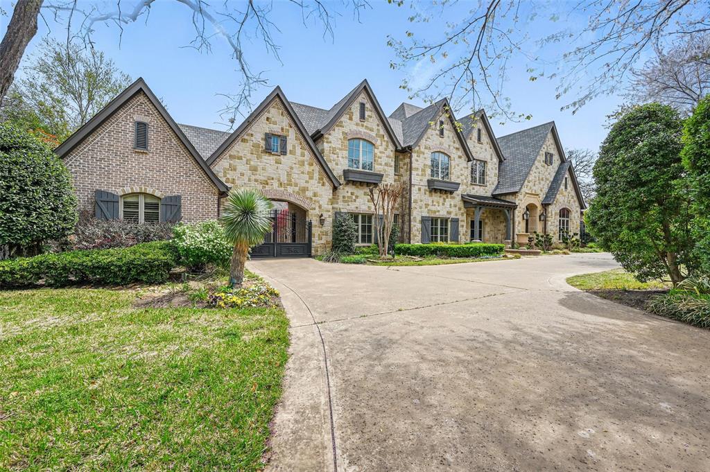 This stunning estate is nestled in the Westwyck Hills community of Southlake, within the highly sought-after Carroll ISD. Built by Scott Simmons, this luxurious home spans nearly one acre of private, tree-lined land and features a gated porte-cochère leading to a four-car garage. Upon entering, you'll be greeted by a formal dining room and a library with a cast stone fireplace that leads into the executive office.The family room opens to a chef’s kitchen, equipped with top-tier appliances, a built-in coffee maker, copper sink with a separate prep sink in the island, and a walk-in pantry. The temperature-controlled wine room adds a touch of elegance to the ground floor, perfect for both entertaining and everyday living. Additionally, you'll find a fully-equipped media room, a private ensuite guest room, a versatile bonus room, and a luxurious primary bedroom retreat. Upstairs, the grand staircase leads to three spacious ensuite bedrooms and a game room with a large walk-in storage closet. Step outside to your own personal oasis: a breathtaking Claffey infinity-edge pool, spa, and a covered patio complete with a built-in outdoor kitchen and fireplace. The backyard also features full-turf, offering the perfect space for relaxation and entertainment.