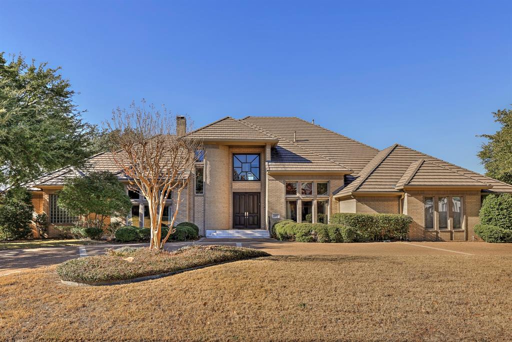 Welcome to this exquisite property located in the highly sought-after 24-hour guarded and gated Mira Vista subdivision, perfectly situated overlooking the lake and the 8th fairway of the golf course. From the moment you enter the grand foyer, you’ll appreciate the attention to detail and breathtaking panoramic views throughout the home. The spacious main-level primary suite offers backyard access and a luxurious ensuite with dual vanities, a garden tub, and a separate shower. The well-appointed kitchen meets every culinary need with a Sub-Zero refrigerator, gas cooktop, center island, granite countertops, and dual pantries. Additional features include a full-size office library ideal for working from home, a private exercise room, and an oversized three-car garage. The outdoor living space impresses with a fabulous pool perfect for relaxing or entertaining. Upstairs, a large game room with access to both balconies provides spectacular views, while three additional bedrooms offer comfort and privacy. This exceptional home is a true haven of luxury, elegance, and tranquility.