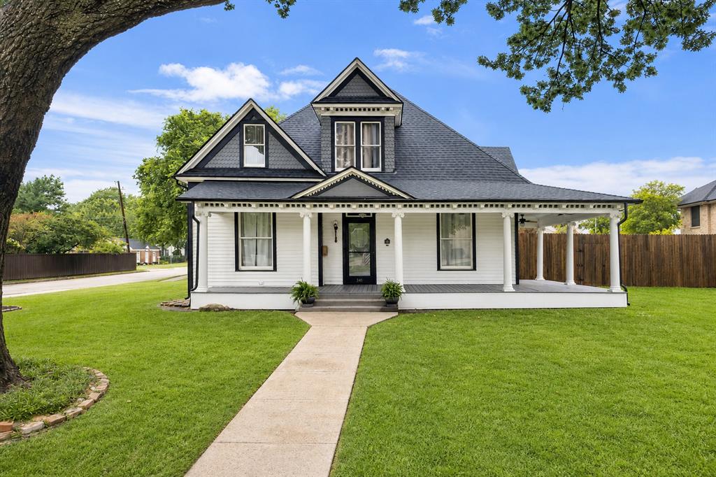 The Marvin Manor! A new home inside a 1904 Victorian Masterpiece - fully restored in 2021. This is the rare historic property that gives you everything — the soul, craftsmanship, and architecture of a true historic house with the systems, comfort, and confidence of brand-new construction. Taken down to the studs and tastefully rebuilt, this 5-bedroom, 4.5-bath custom home on iconic W Marvin Avenue is genuinely one of a kind. Proudly featured on the Waxahachie Home Tour in both 2021 and 2022, the home was restored with deep respect for its original character — preserving the period architecture and details that make these homes so beloved — while delivering the modern conveniences today's buyers expect. Within the last five years, the home received all-new HVAC, plumbing, electrical, foundation, and roof (2025). Inside, crown molding graces the kitchen and the entire downstairs, complementing custom cabinetry, quartz countertops, and a large island. Rich Red Oak hardwood floors run throughout, adding warmth and timeless character. The luxurious primary suite features a classic bathtub with a show-stopping walk-in shower and an oversized closet with custom built-in cabinets. The upstairs bedrooms contain charming nooks and inviting spaces that add the warmth only a classic home like this can offer. Freshly painted and fully move-in ready. Set on a large corner lot with a large L-shaped wrap-around front porch and a backyard built for gathering — complete with a fenced garden and two chicken coops inside an enclosed shelter. All of this on one of Waxahachie's most coveted historic streets. Walkable to downtown, shopping, and dining. Homes like this do not come along often!
