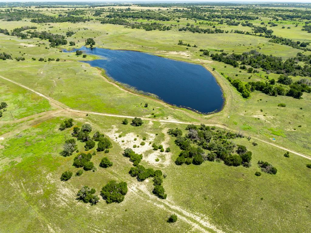 1,048± Acres — Exceptional Large-Acreage Ranch West of Evant, Texas
A rare opportunity to own a highly improved, large-scale ranch in Hamilton County, offering the ideal blend of cattle operations, farming, water, elevation, and outstanding hunting. This impressive ranch lies just west of Evant and features over 100 feet of elevation change, creating sweeping views, rolling terrain, and excellent natural drainage with scattered tree cover throughout.
Improvements include an older farmhouse that the owner began remodeling—ready for completion and personalization—along with a metal workshop and a nice set of working cattle pens. The ranch is well-suited for livestock with approximately 60 acres of Tifton Bermuda grass, 75 acres of farmland, and native pasture beyond. Interior fencing is mostly electric, and the property is divided into 15± pastures, each with water access, allowing for efficient rotational grazing.
Water is a standout feature with two water wells, six stock tanks, and a 12+ acre lake, plus seasonal branches running through the ranch—providing dependable water for cattle and exceptional wildlife habitat. The abundant cover, water, and terrain make this ranch excellent for hunting, with strong populations of whitetail deer, turkey, and native game.
The ranch is centrally located in Central Texas, approximately 30 minutes to Hamilton, Goldthwaite, Gatesville, and Lampasas, about 1 hour to Brownwood, Stephenville, and Killeen, and roughly 1.5 hours to Waco and Temple. Medical services are conveniently close, with Hamilton Hospital approximately 30 minutes away.
If you’re looking for a large, well-watered, and versatile ranch near Evant with cattle infrastructure, productive grass and farmland, big water, elevation, and top-tier hunting, this 1,048-acre property stands out as a premier Central Texas offering.