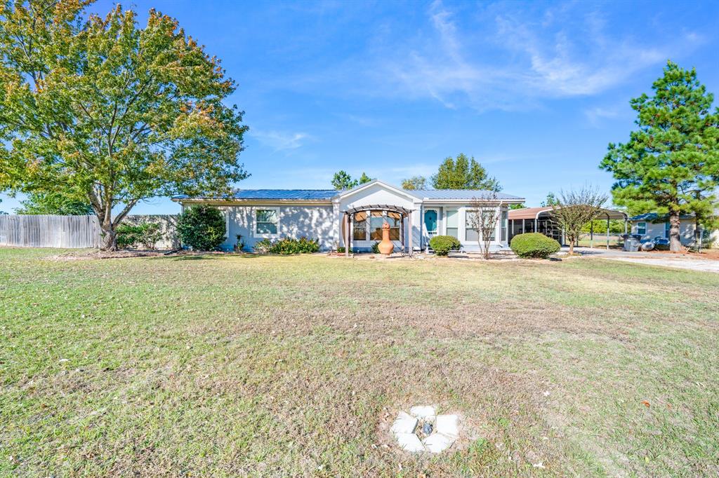 Country Charm Meets Modern Comfort!
Welcome to 140 County Road 2302 in Sulphur Springs, TX — a beautiful 1998 Valley Classic modular home with 1,860 sq. ft. of living space on over half an acre!

This inviting 3-bedroom, 2-bath home includes a formal dining room, home office or library, and tons of upgrades — from the brand-new metal roof (April 2025) to new flooring, water heater, dishwasher, and disposal.

Enjoy outdoor living under the front pergola, relax on the 12x20 back patio, or make use of the 20x20 shop, RV hookup, and covered carport. The fenced backyard and 50x20 gravel driveway complete this move-in-ready gem!