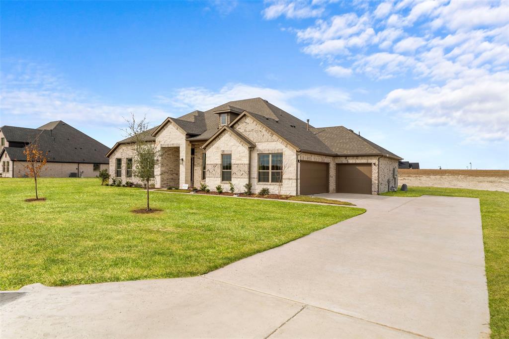 There’s an immediate sense of ease as this single-story home opens into a wide central living area designed for connection, comfort, and everyday flow. With 4 bedrooms, 3.5 baths, and 2,665 sq ft, the layout feels thoughtfully scaled—spacious where it matters, purposefully arranged where privacy is needed. The heart of the home centers around a bright living room accented by vaulted ceilings and a gas-log fireplace, creating a warm focal point that anchors both quiet evenings and lively gatherings.

The kitchen blends clean lines with practical function, offering a large island, abundant storage, and a walk-in pantry that makes organization feel effortless. The dining room sits just steps away, giving the entire main space a seamless, open feel without sacrificing defined zones for living and entertaining.

A dedicated game room offers a second gathering space—ideal for movies, hosting friends, or carving out a retreat for hobbies or study sessions. Each bedroom is positioned with intention, offering peaceful corners for rest, guests, or multi-generational living. The primary suite stands out with its spacious bath featuring dual vanities, a soaking tub, a separate shower, and a walk-in closet designed with everyday convenience in mind.

Stepping outside, the covered patio becomes a natural extension of the home, overlooking a full acre of land—plenty of room for future outdoor living, gardens, or simply enjoying open space. Energy-efficient details, decorative lighting, a three-car garage, and modern utilities support the home’s polished feel, while the Levante community offers quiet surroundings without sacrificing access to Waxahachie’s shopping, dining, and major roadways.

Schedule a showing and experience how this home balances space, function, and a beautifully relaxed atmosphere.