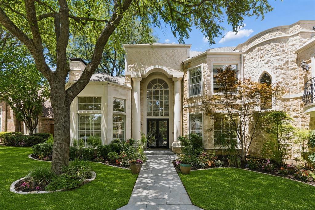 Located in a prestigious guard-gated community with 24-hour security, this exceptional custom home by Kienast & Helms Custom Homes offers 5 bedrooms,each with its own ensuite bathroom,multiple living areas,and a functional floor plan.Features include real hardwood floors,plantation shutters, French drains, and a 3-car garage with epoxy floors.The functional layout includes the primary and a secondary bedroom on the 1st floor, while 3 additional bedrooms and an oversized media room are upstairs.Two separate staircases provide access to the 2nd level and enhance flow.The primary suite serves as a private retreat featuring its own fireplace,oversized walk-in shower with dual shower heads,separate vanities,private his-and-her water closets,large walk-in closets,and motorized shades in addition to plantation shutters,allowing you to enjoy backyard views and natural light or create a cool, dark space for relaxation.The secondary downstairs bedroom is ideal as a guest suite or office.A wet bar near the main living area creates the perfect setup for entertaining.The kitchen features stainless steel appliances, generous counter space,two pantries, extensive cabinetry, and seamless access to the living and dining areas. Storage is exceptional with two large first-floor storage closets,a coat closet,and walk-in closets throughout.Upstairs, the expansive media room includes its own ensuite bathroom, marble countertops, a built-in mini refrigerator, and access to two private balconies overlooking both the front of the home and backyard pool and spa. The balconies were installed in Nov. 2025 and include transferable two-year warranties.Designed for indoor-outdoor living, the property features a large pool and spa, covered patio, private courtyard, and a dedicated pool bathroom with exterior access. Located in one of Dallas' most sought-after gated communities with convenient access to DNT and PGBT, this remarkable home offers privacy, security, and timeless custom craftsmanship.