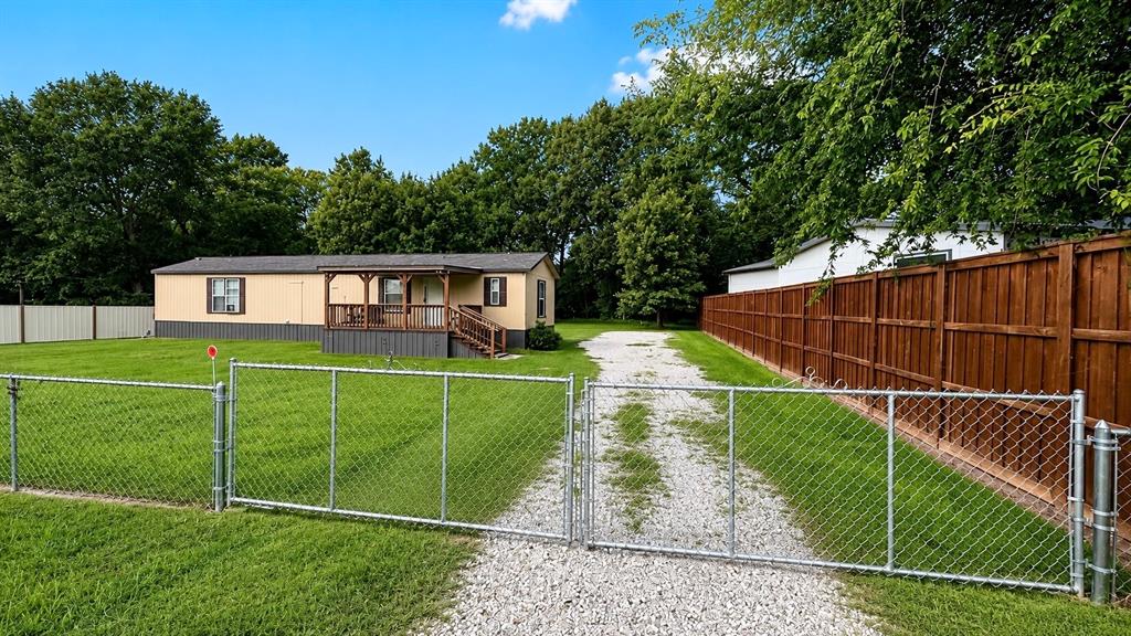 Welcome to Holiday Villages of Fork! This beautifully maintained 2022 Clayton Solitaire single-wide mobile home offers 2 bedrooms, 2 bathrooms, and sits on three spacious lots measuring approximately 120’ x 167’ (.45 acres).

Built with durable Hardie board siding and attractive vented metal skirting, this home combines curb appeal with low-maintenance living. Enjoy outdoor living with two large covered porches, perfect for relaxing, entertaining, or enjoying the peaceful East Texas surroundings. The property also includes a metal storage shed stocked with a riding mower, push mower, and additional yard maintenance equipment that will convey with the sale.

Inside, you’ll find a well-appointed interior featuring sheetrock walls, quality wood cabinetry, a stainless-steel double sink, stove, microwave, refrigerator, chest freezer, washer, dryer, and a large flat-screen TV. The home is being offered fully furnished, making it truly move-in ready. The spacious primary suite features a large walk-in closet, while the primary bath offers a soaking tub, oversized shower, and abundant storage space.

The exterior is equally impressive with a chain-link fence with single and double gate across the front of the property and privacy fencing along both sides, providing security and seclusion.

Residents of Holiday Villages of Fork enjoy access to a wide range of amenities, including fishing piers, boat ramps, a saltwater swimming pool, clubhouse, playgrounds, picnic areas, and a full calendar of community activities such as bingo, karaoke, potlucks, and painting classes. HOA dues are only $52 per month, with community well water filtration and sewer services available for $65 each per month plus usage.

Bring your golf cart, boat, RV, and fishing poles and start enjoying the Lake Fork lifestyle. Don’t miss this opportunity to own a fully furnished, feature-packed property in one of Lake Fork’s most sought-after gated communities.