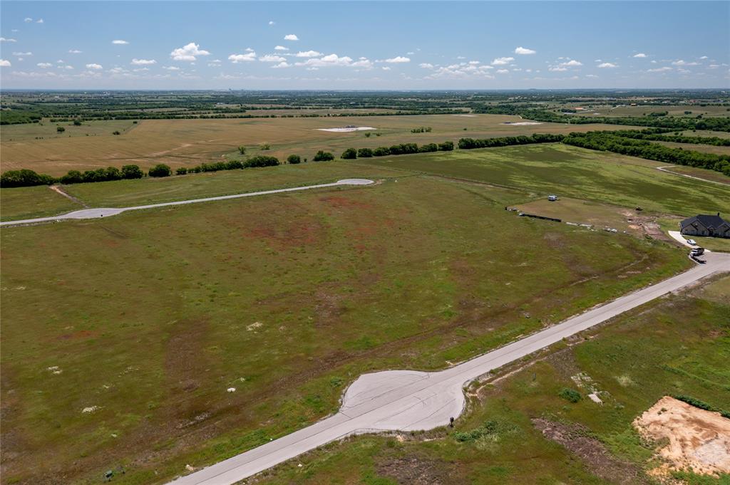 Located in the peaceful and serene phase 2 of Legacy Ranch. Incredible opportunity to build your dream home on an over 2 acre lot in the rapidly growing city of Krum! Flat land primed for a gorgeous home, shop and much more! Plenty of space for you animals to roam. Electricity at the road. Ready for a well and septic for self sustainment. No HOA! Only 15 miles into Denton. Sought after Krum ISD.