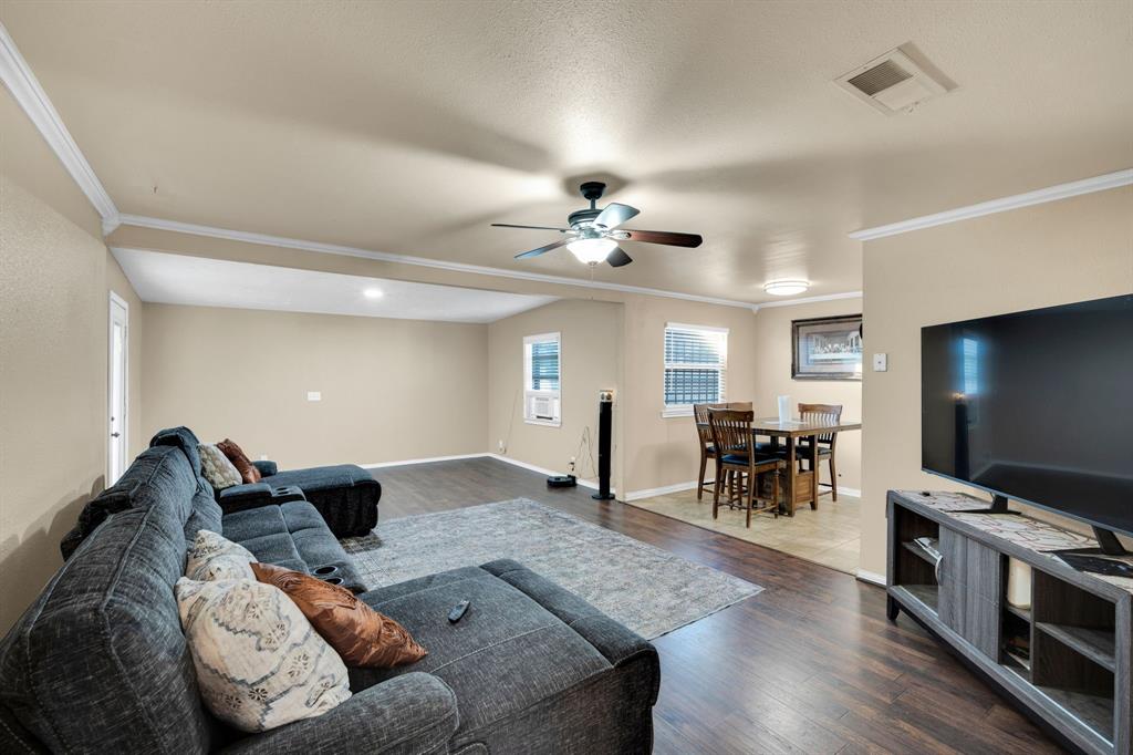 Charming & Move-In Ready Near Downtown Fort Worth! Welcome to 4916 Eastover Avenue, a well-maintained single-story home offering spacious living areas and thoughtful updates just minutes from Downtown Fort Worth. This 3 bed 2 bath 2 car garage home features an open-concept living and dining area with wood-look flooring, crown molding, and abundant natural light. The kitchen includes granite countertops, stainless steel appliances, tile backsplash, and ample cabinet space. Bedrooms are generously sized with ceiling fans and updated finishes throughout. Bathrooms feature granite counters and tiled surrounds for a clean, modern touch.  The family room has been recently extended into the previous den make a single large living room.  Enjoy a large backyard with mature trees and plenty of room for entertaining, pets, or future outdoor upgrades. The two-car garage and wide driveway provide ample parking and storage. Conveniently located near major highways, shopping, dining, and Downtown Fort Worth — this home offers comfort, space, and accessibility at an excellent value. Schedule your showing today!