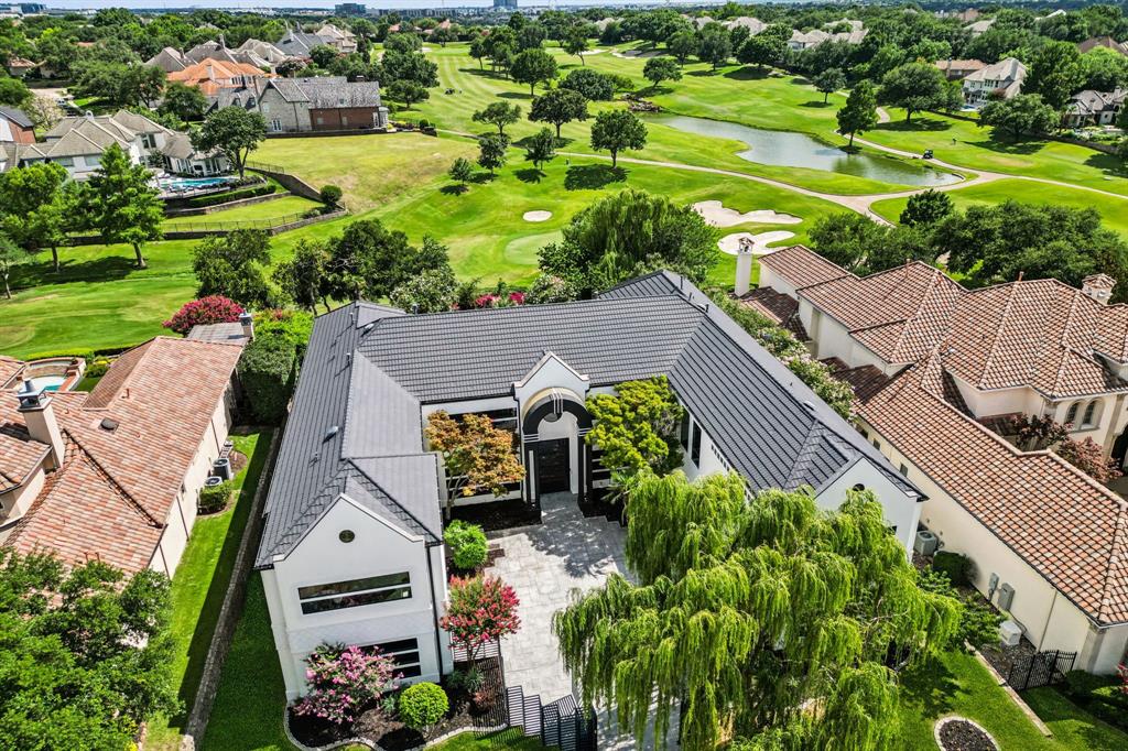 A Contemporary Masterpiece in Guard-Gated Stonebriar
Welcome to 6 Savannah Ridge Drive—an architectural showpiece nestled within Frisco’s prestigious guard-gated Stonebriar community. Spanning 9,787 square feet, this fully reimagined estate blends sleek modern design with resort-style amenities, offering the ultimate in luxury living.
Step inside to soaring ceilings, a striking floating staircase, and an open-concept layout bathed in natural light from expansive windows that frame both the main living area and the serene primary suite. The chef’s kitchen is a dream—outfitted with top-of-the-line appliances, custom cabinetry, and refined finishes throughout.
Enjoy the flexibility of a private executive office, a fully equipped home gym with both a sauna and steam room, and a next-level game room ideal for entertaining. The media room is fully upgraded with tiered seating and a star-lit ceiling, creating a cinematic experience right at home.
The resort-style backyard is a vibrant retreat, offering panoramic golf course views, colorful landscaping, and a tranquil water feature—ideal for hosting or relaxing in private serenity.
Located just minutes from The Star District, Legacy West, and Grandscape, this home is the pinnacle of Frisco luxury. A true modern masterpiece—designed for comfort, wellness, and unforgettable living.