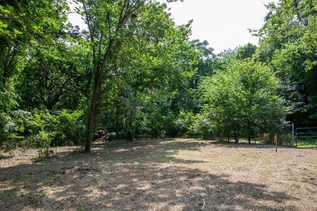 Bring your vision to life on this generous 0.446-acre residential lot in the heart of McKinney. This unique property consists of two adjoining lots and offers a peaceful setting with mature trees and a wooded open space behind the property, providing privacy and a beautiful natural backdrop. Ideally located just minutes from Historic Downtown McKinney, shopping, dining, parks, and major highways. This property offers the perfect blend of tranquility and convenience. Whether you're looking to build your dream home or make a smart investment, this property presents endless possibilities.